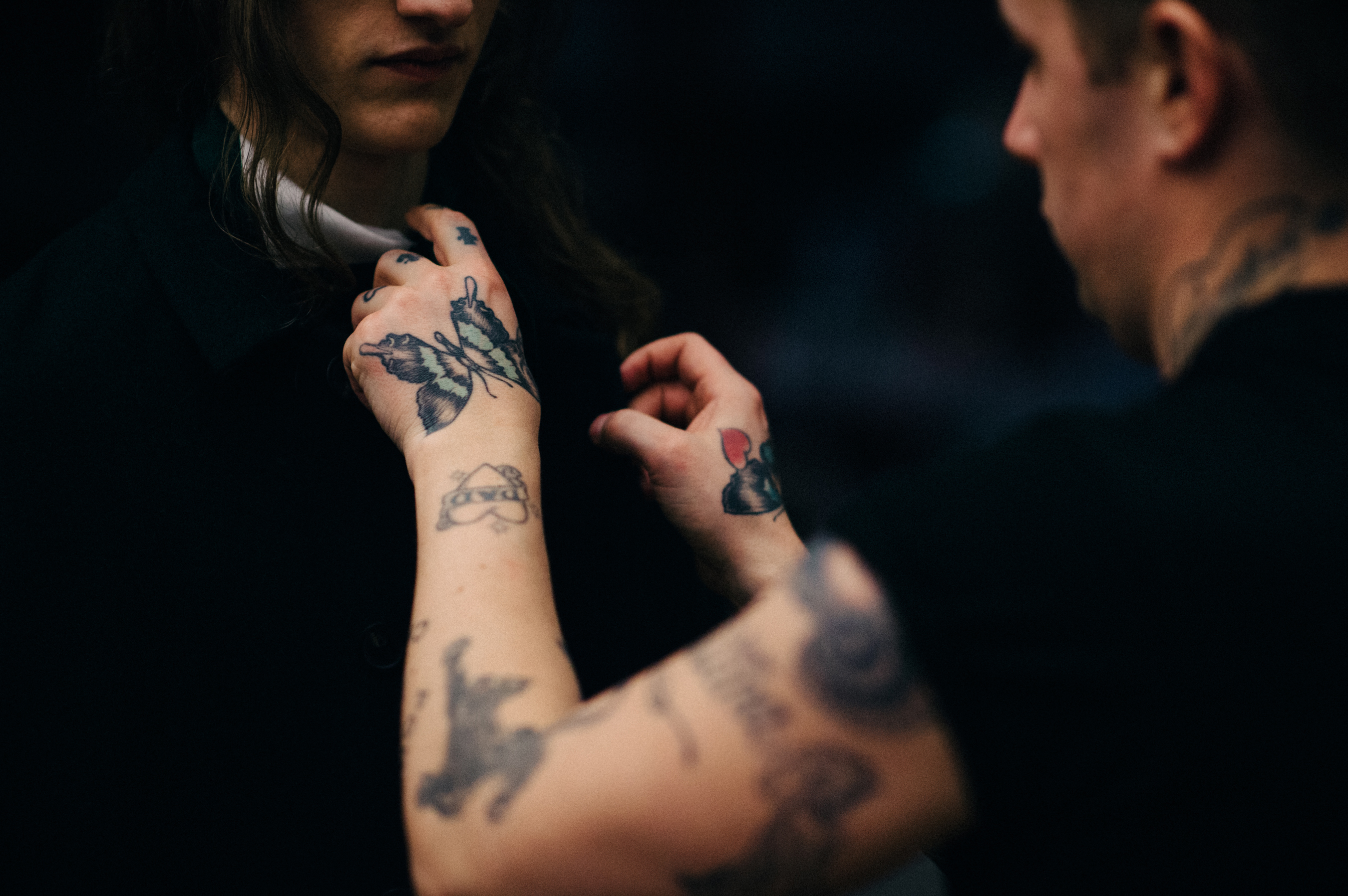 Dresser with tattooed hands