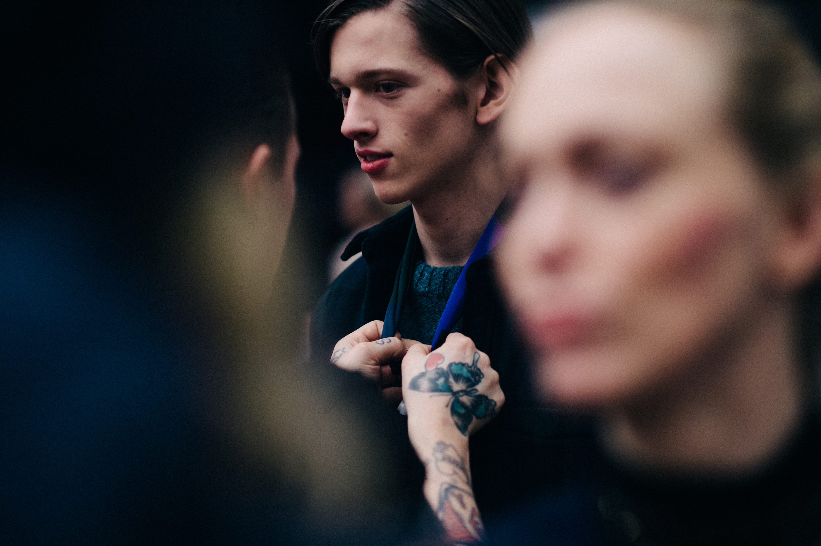 Male model getting dressed