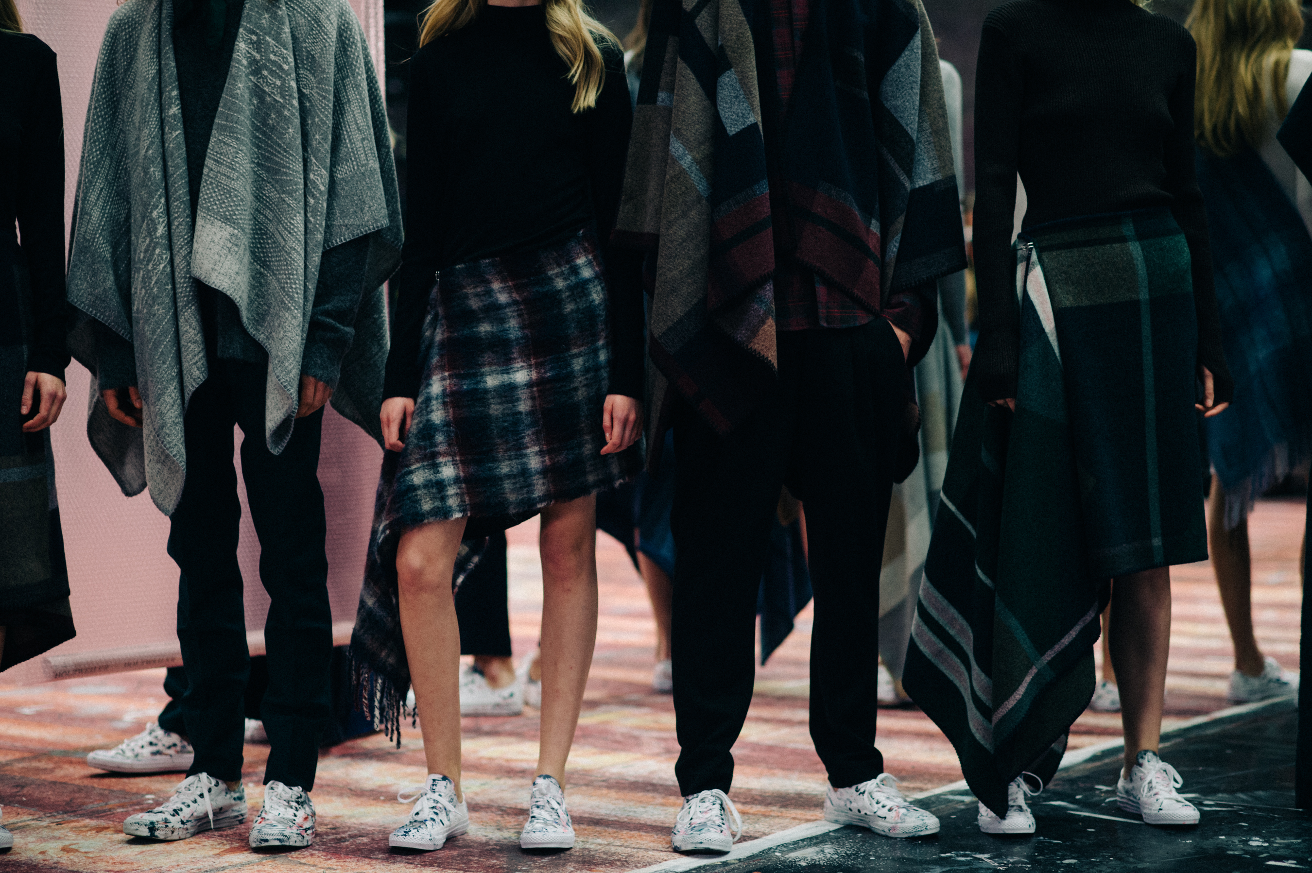 Models lined up in ponchos