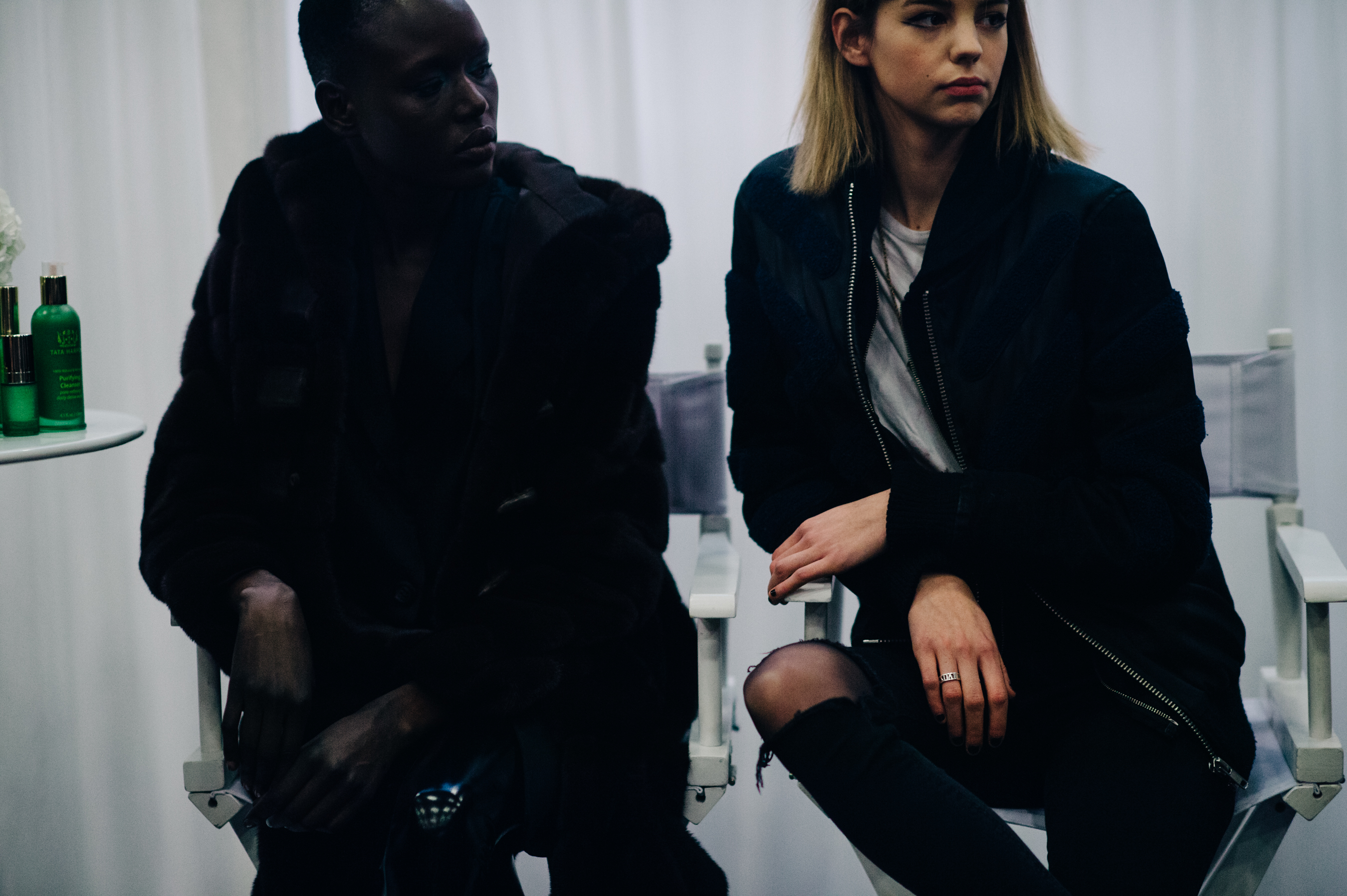 Models sitting on chair