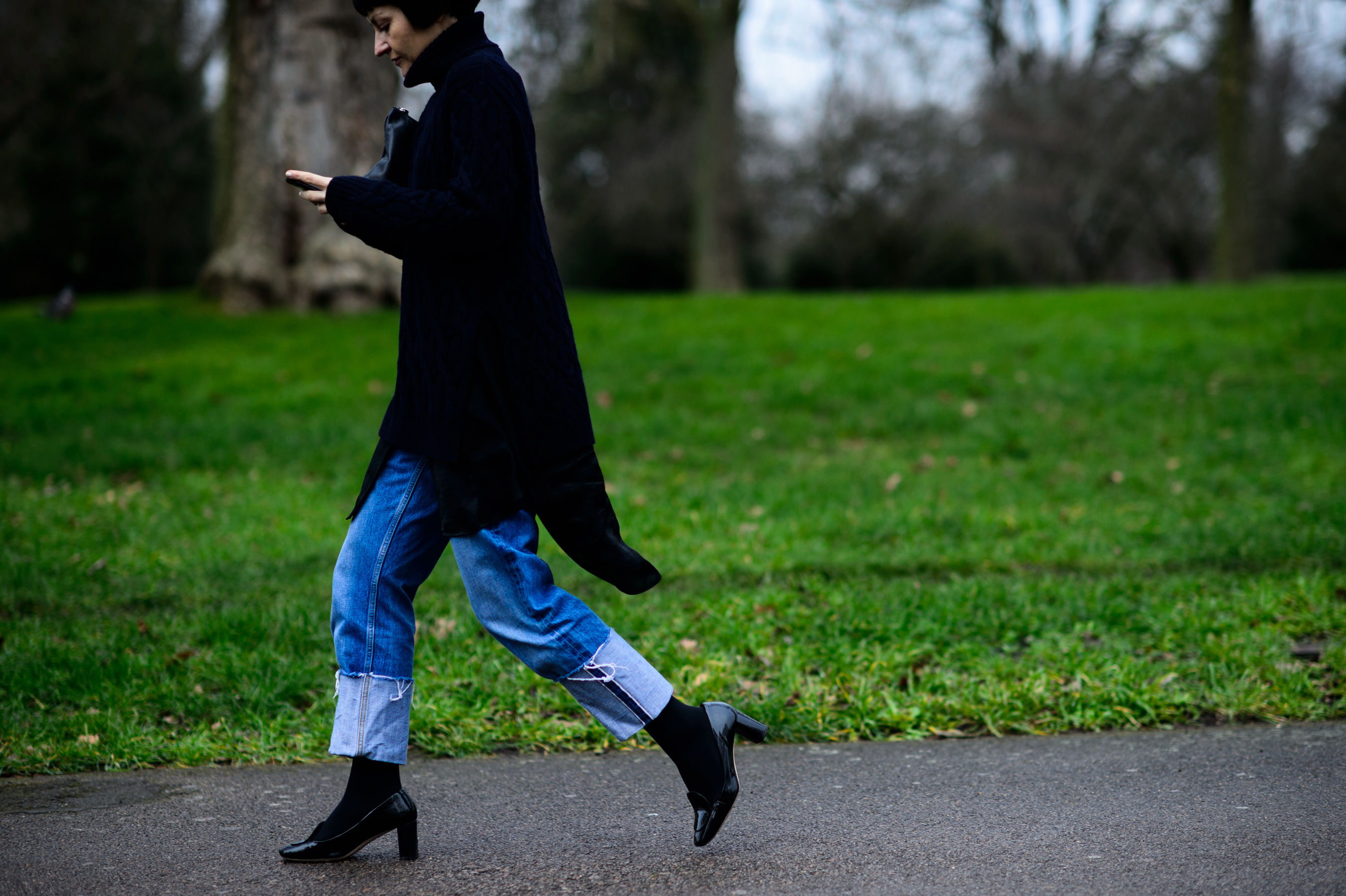 Woman wearing black sweater and jeans