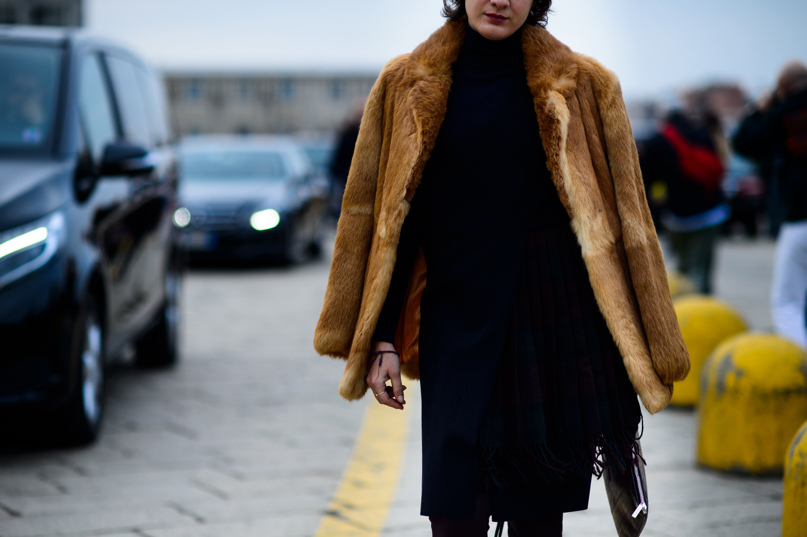 Woman wearing fur coat before show
