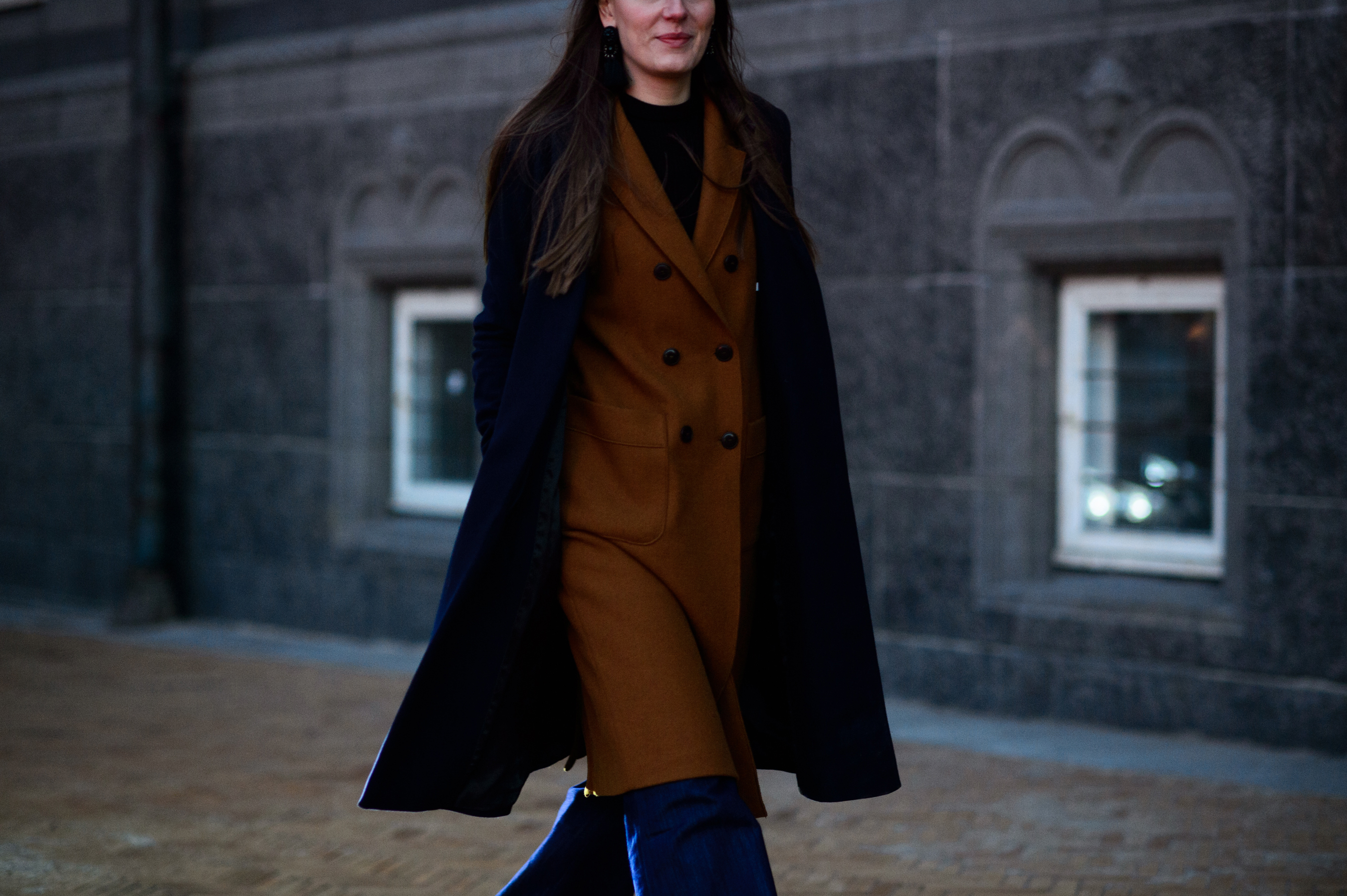 Woman wearing two coats