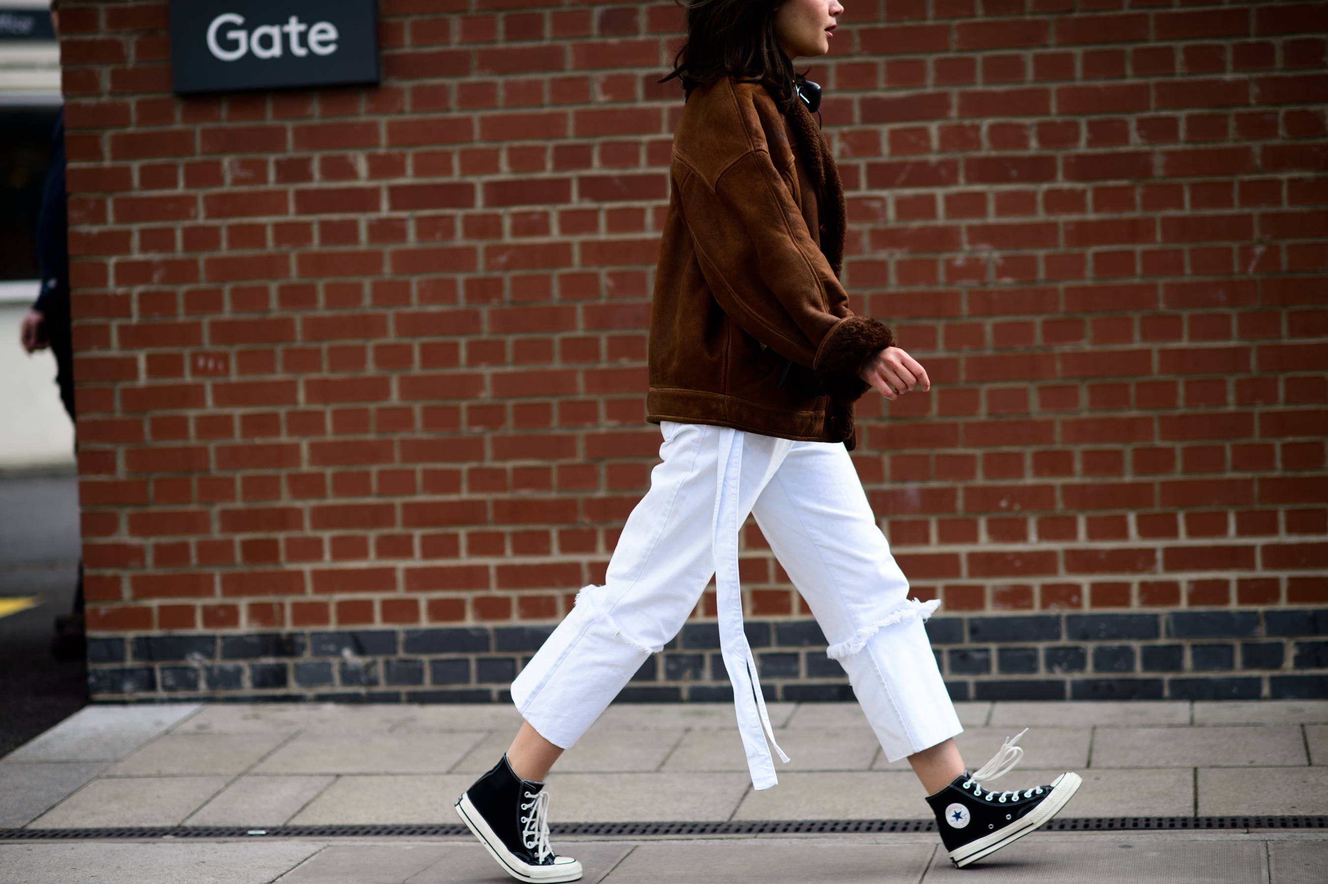 Woman wearing white pants