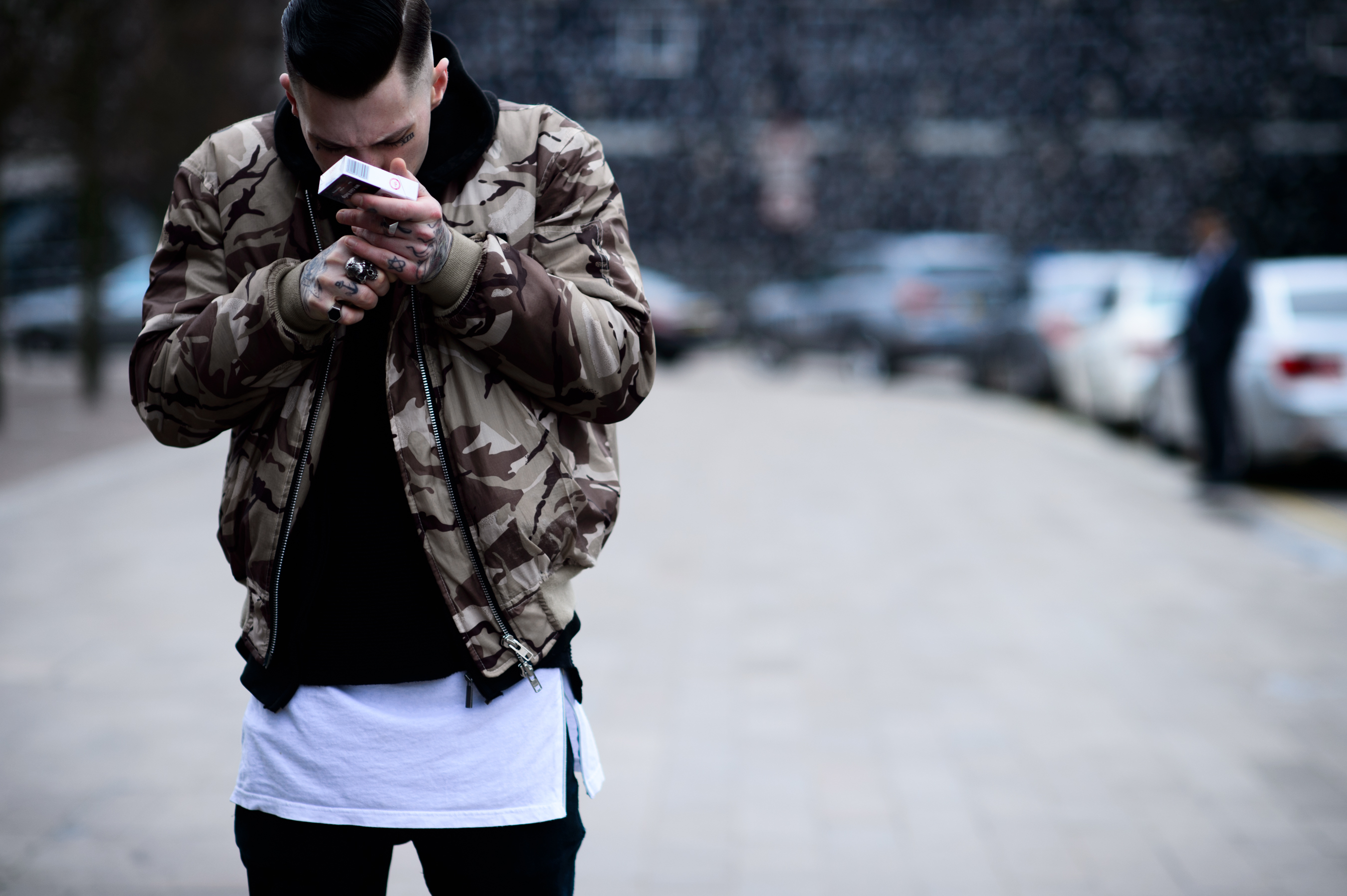 Man with tattoos smoking