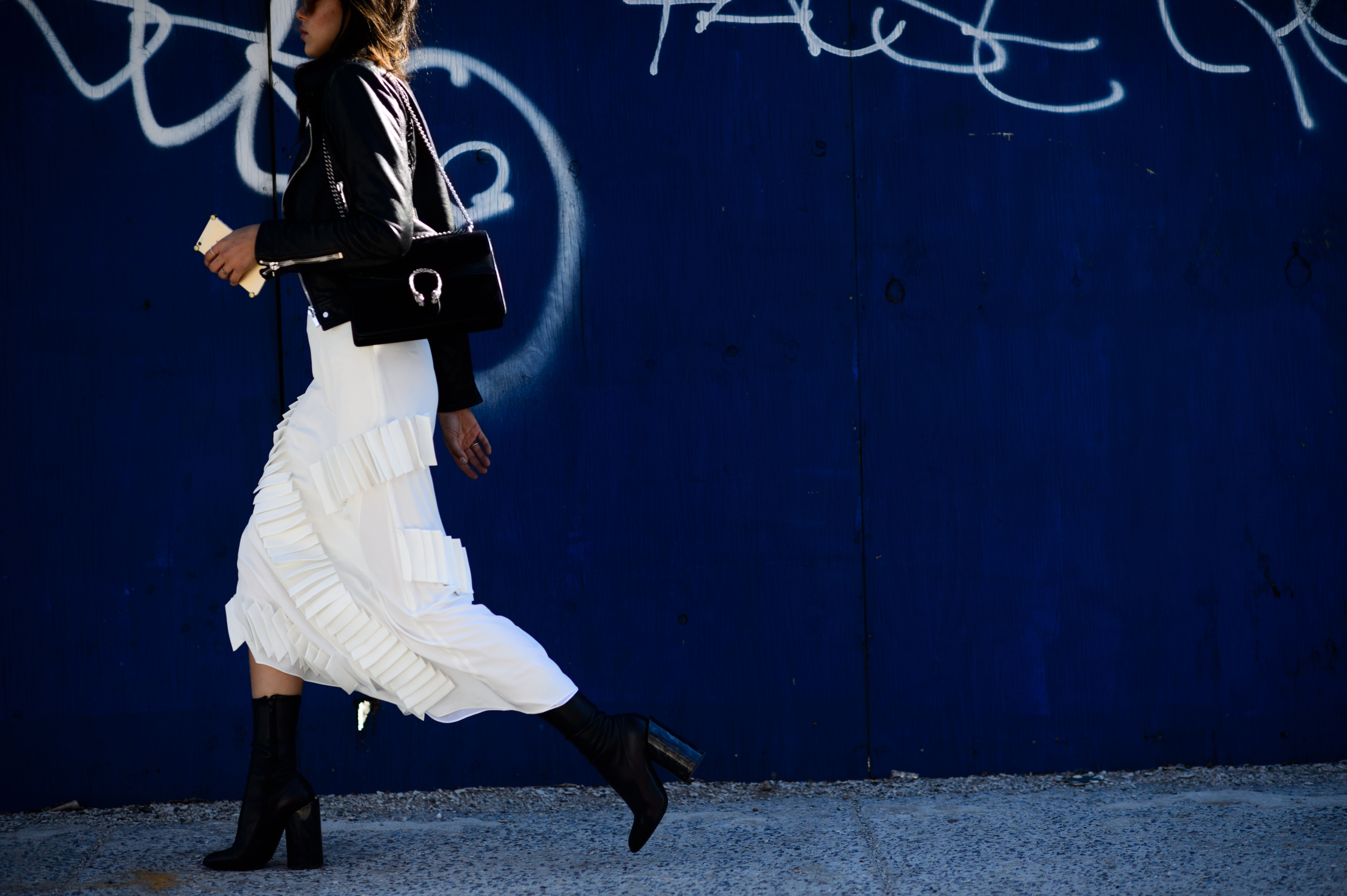 Model wearing white skirt