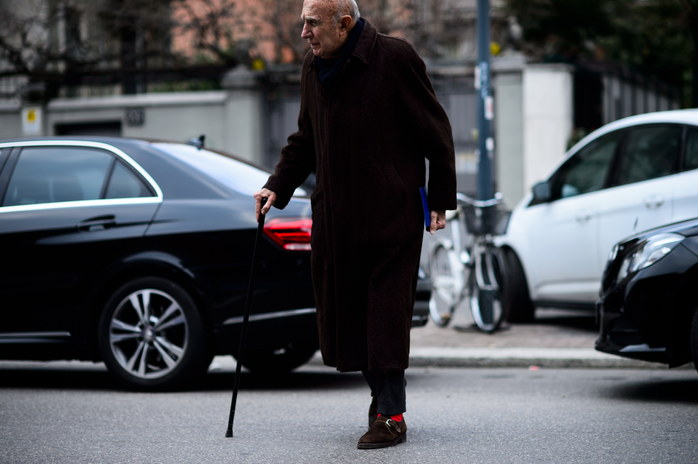 Man with walking stick before the show