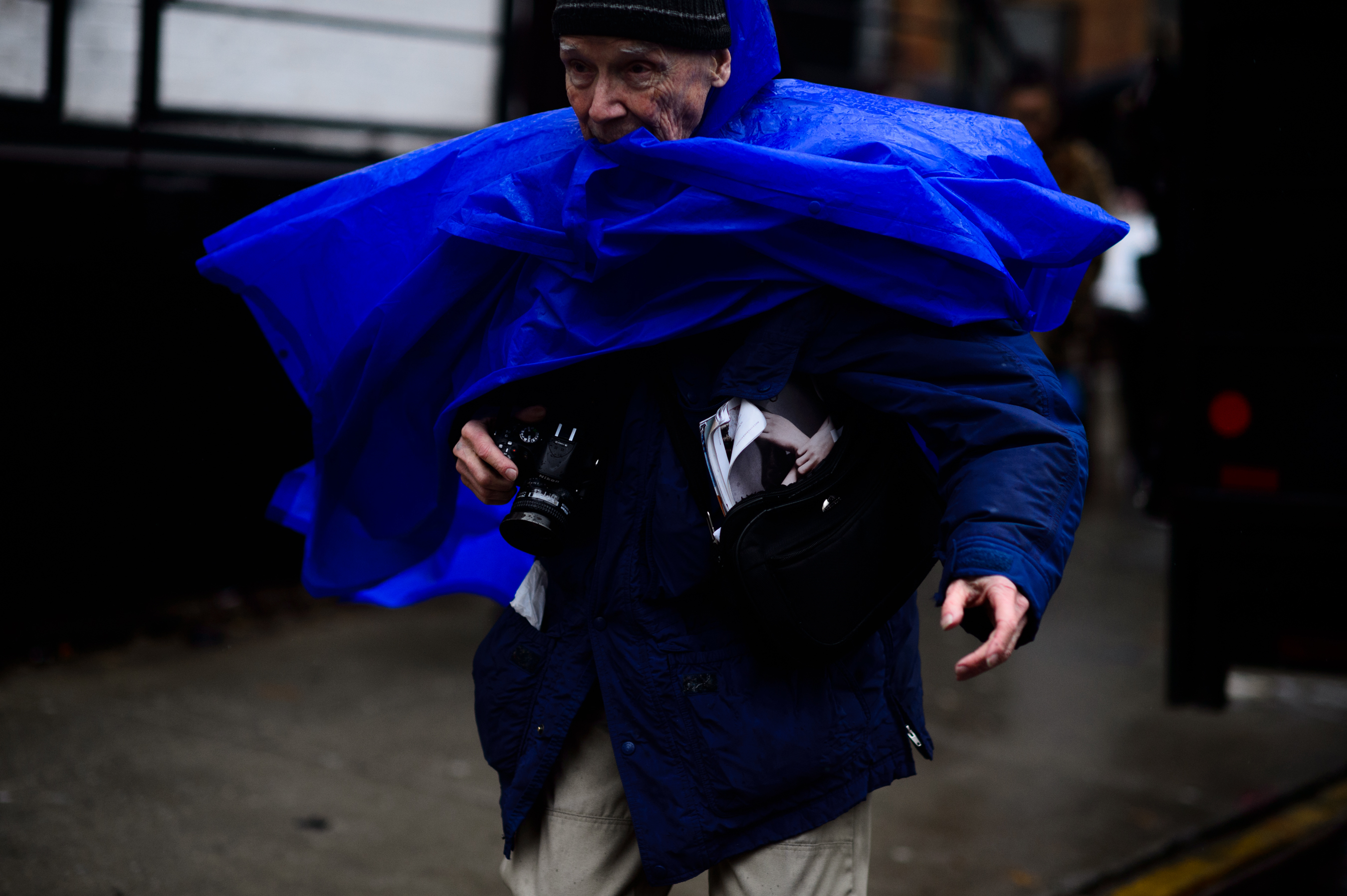 Photographer in blue coat