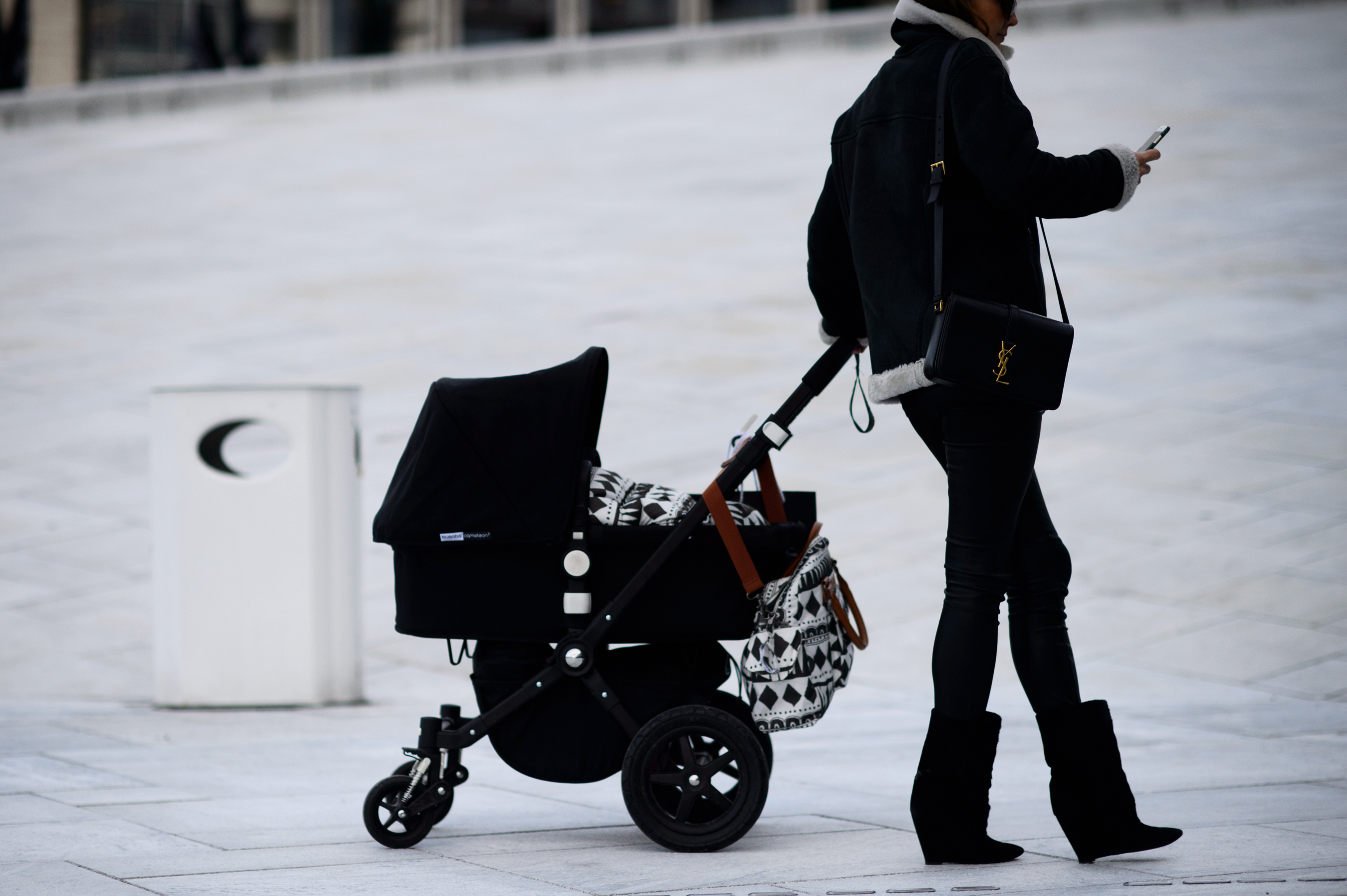 Stylish mother with stroller