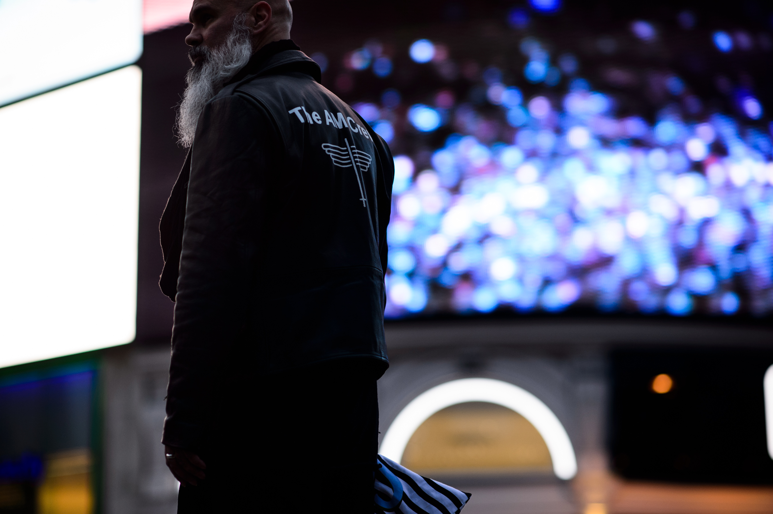 Man wearing AM Crew jacket