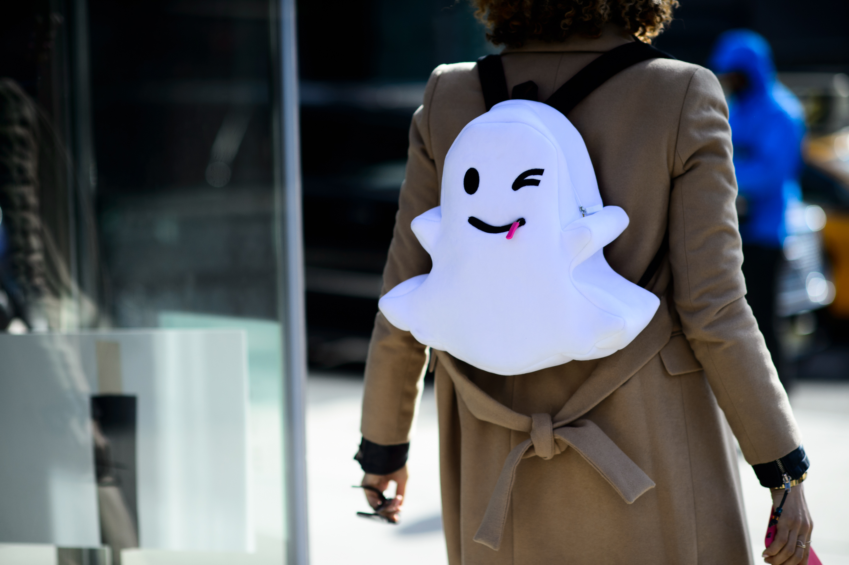 Woman with a ghost backpack