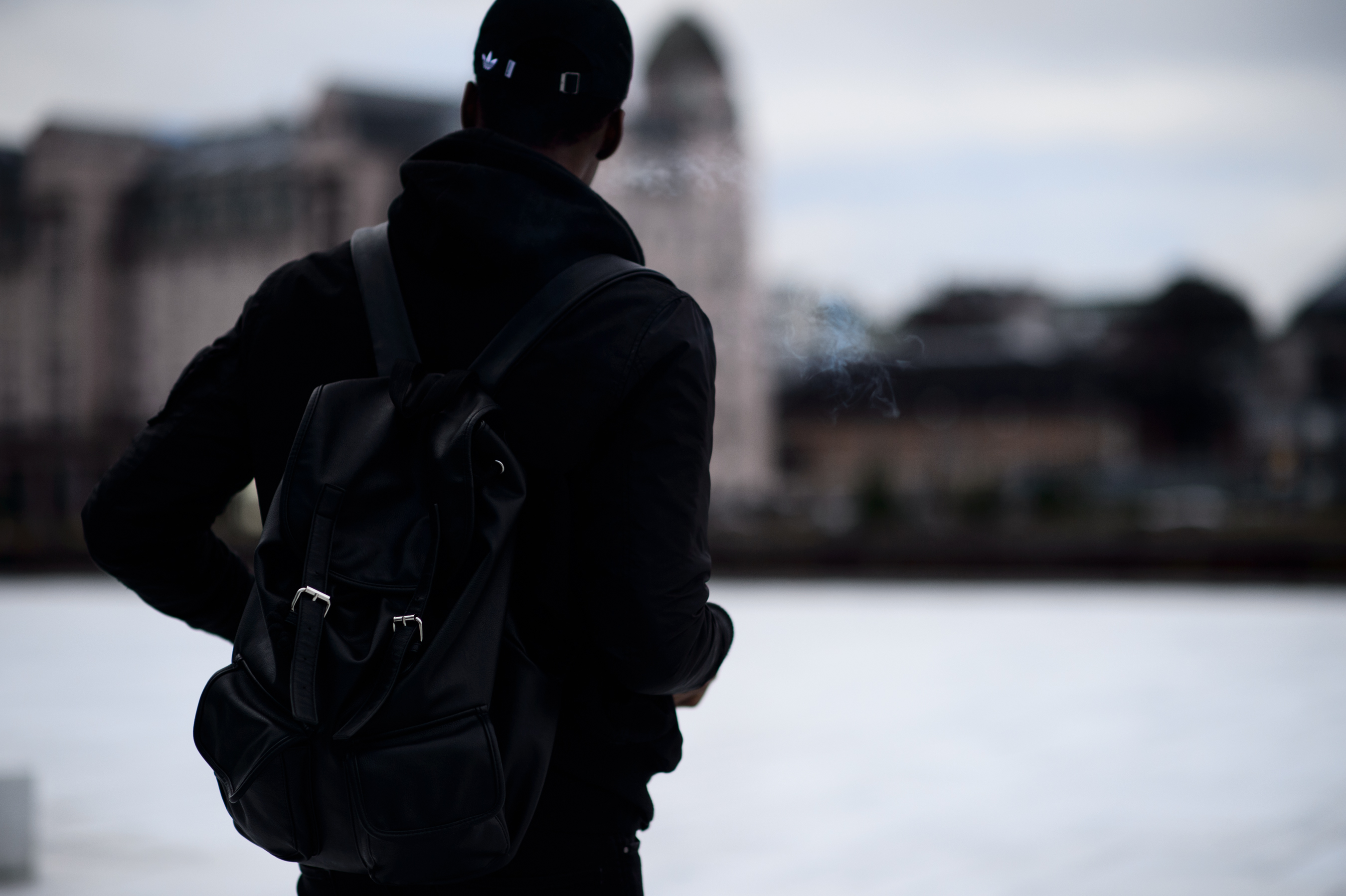 Man in black leather backpack