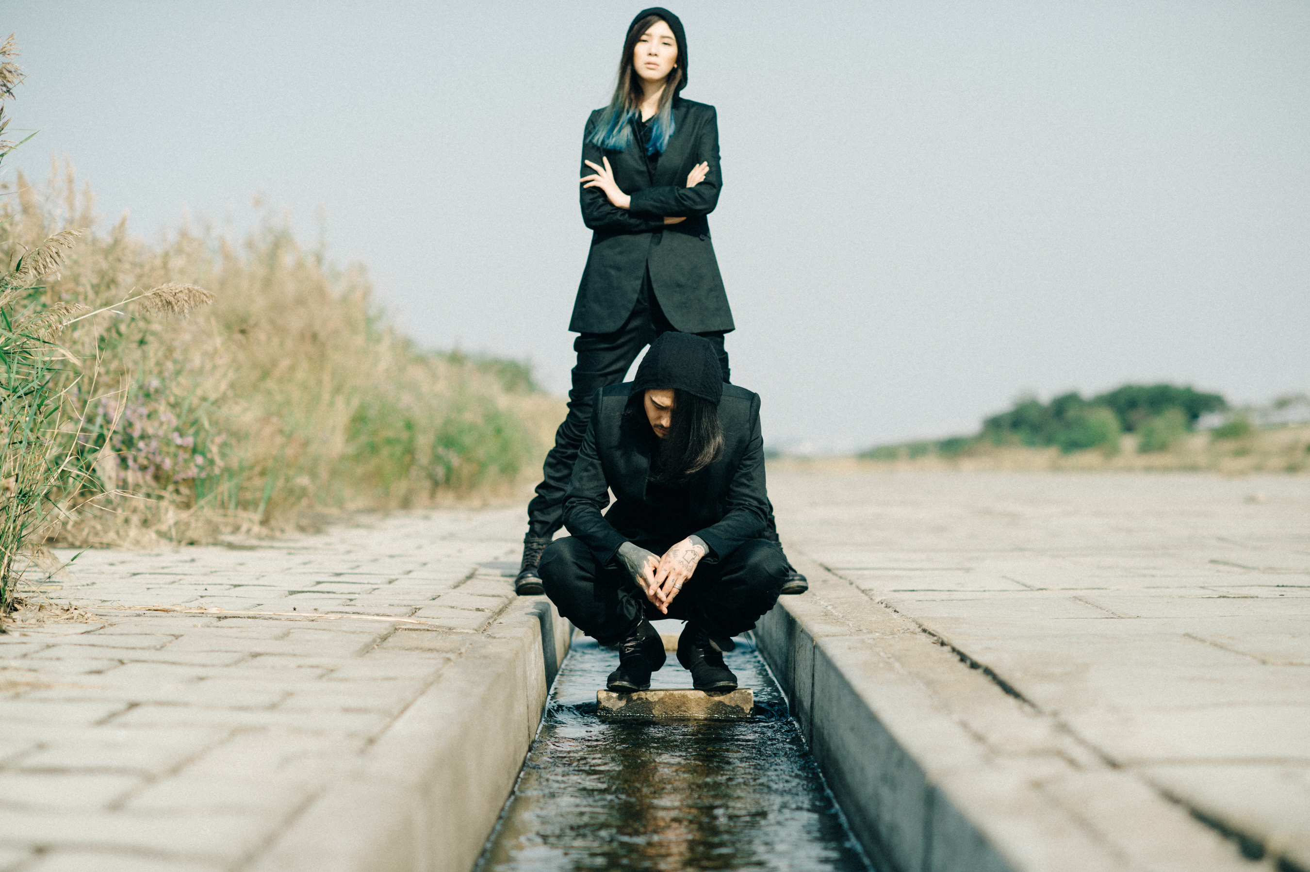 Two Korean models wearing black