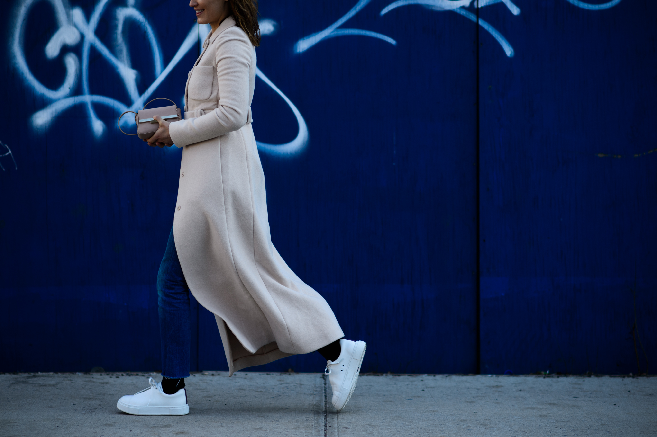 Woman wearing long white coat