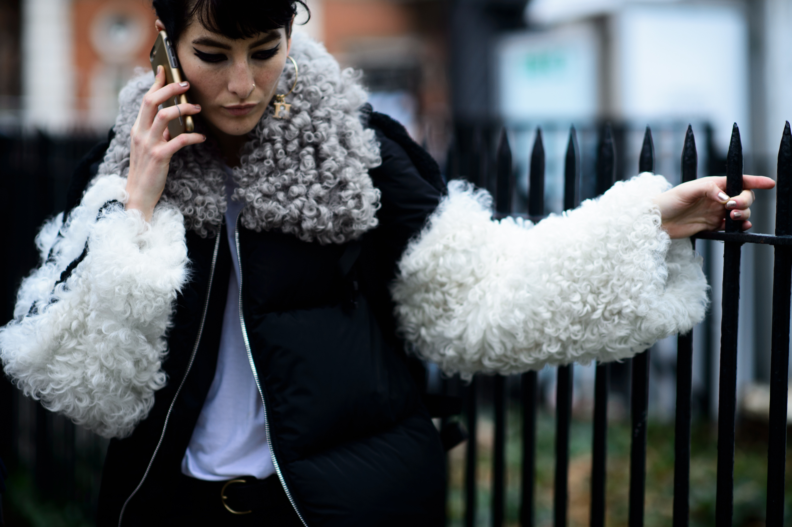 Model wearing shearling sleeves jacket