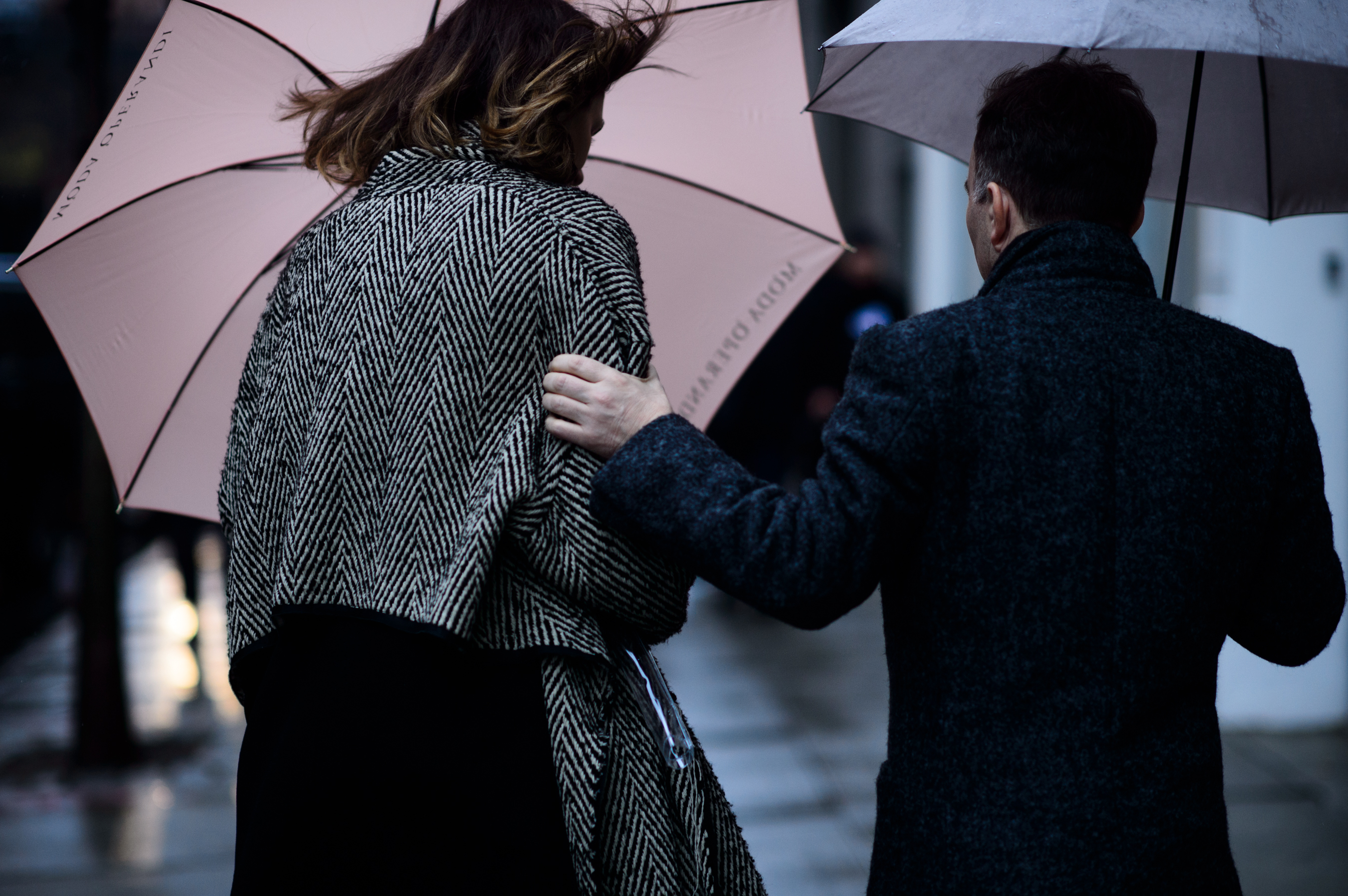 Woman and man with umbrella