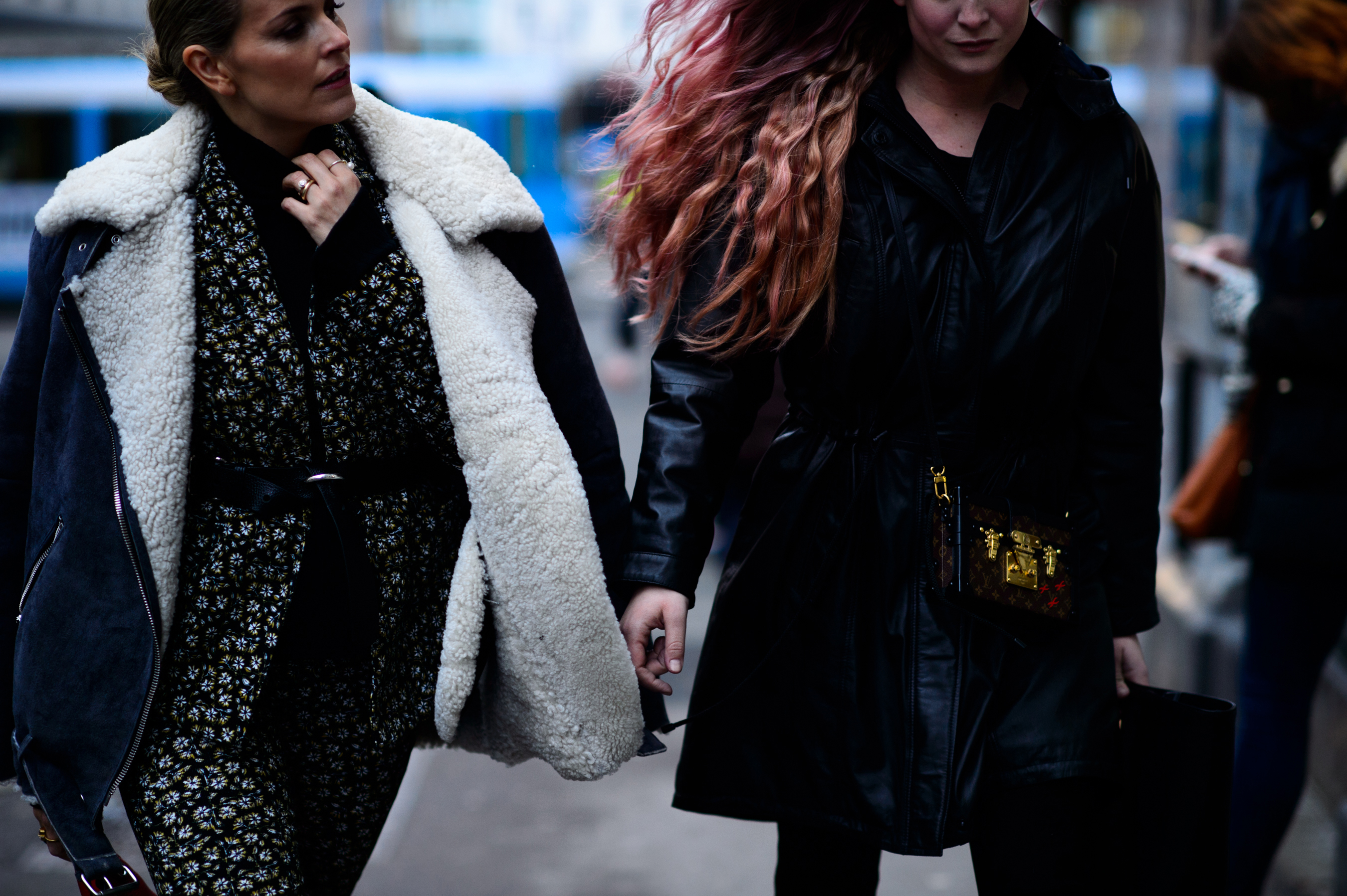 Woman in aviator jacket and pink hair woman
