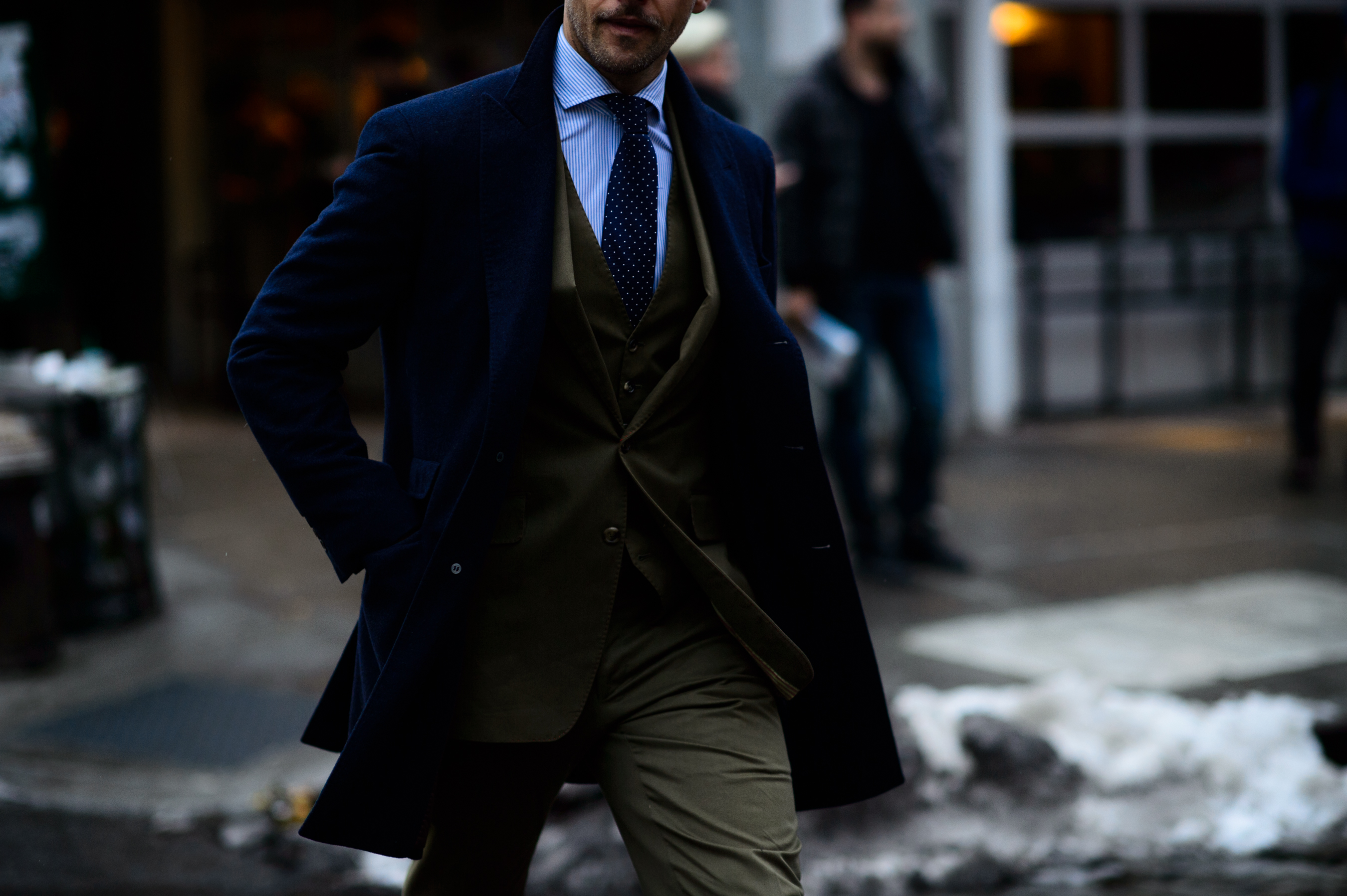 Man wearing suit and coat