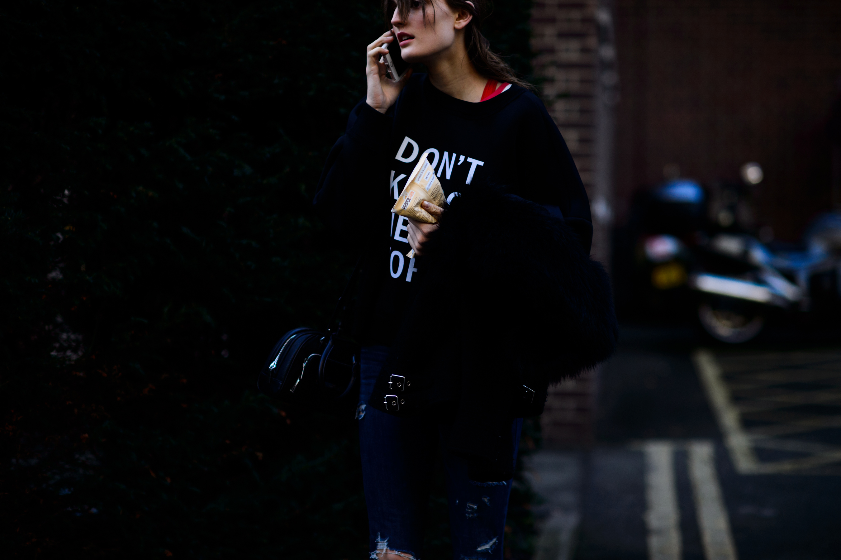 Model wearing DKNY sweatshirt