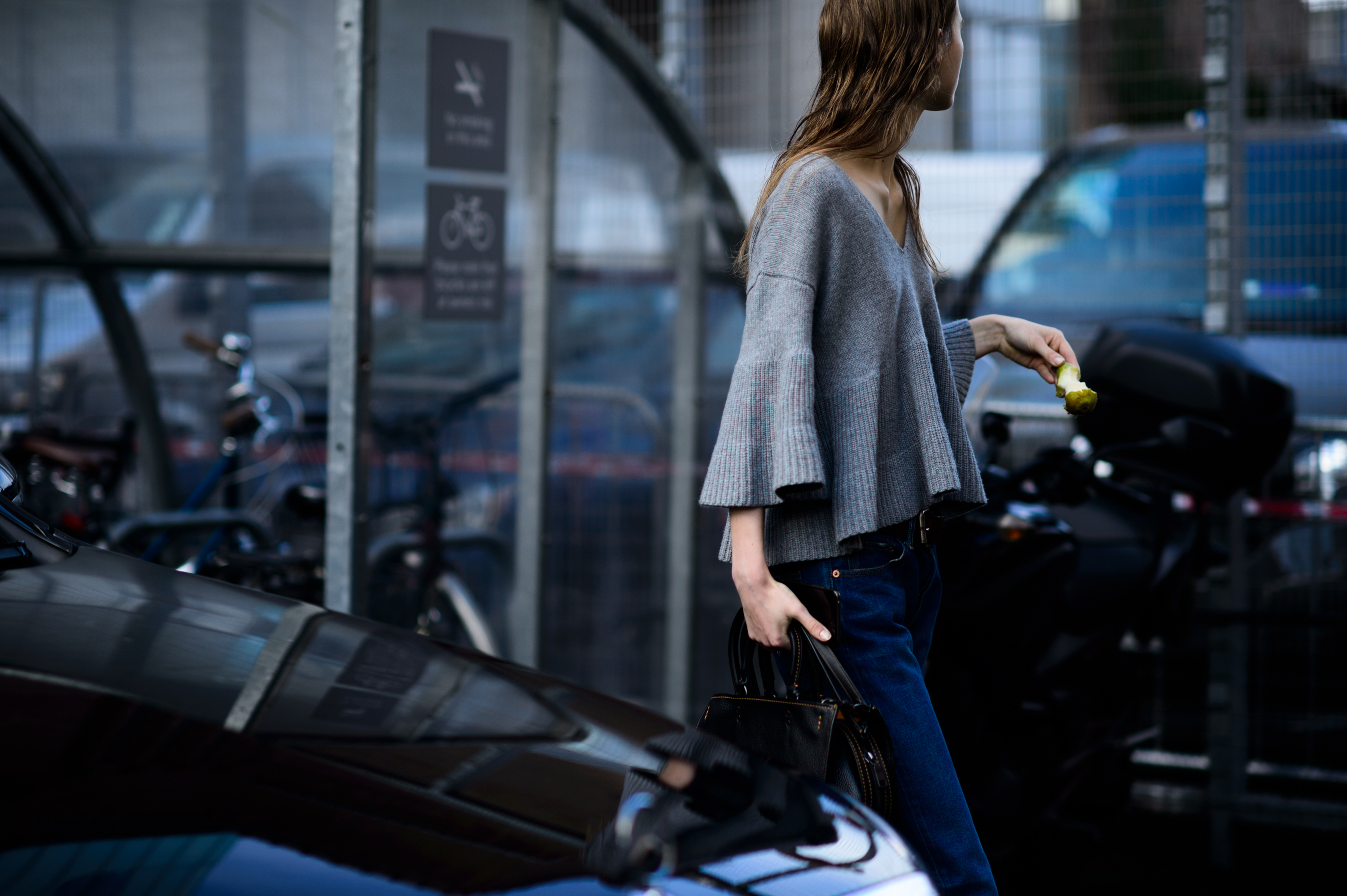 Model wearing grey sweater