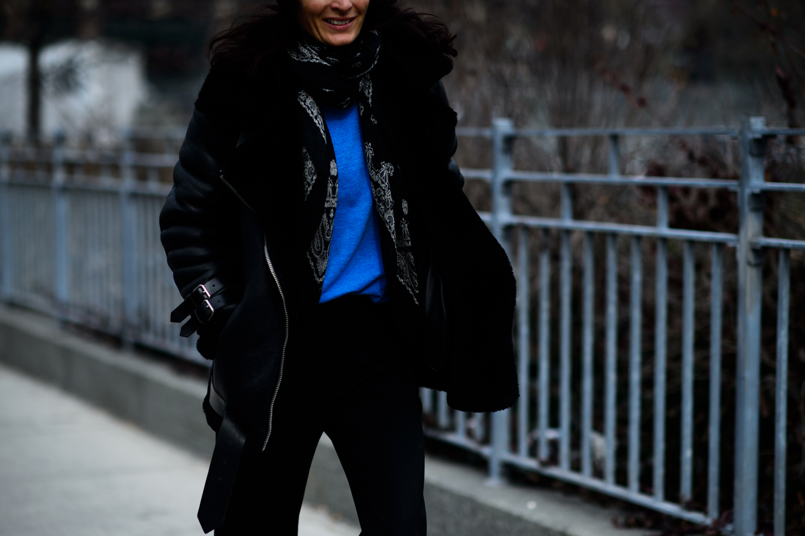 Woman wearing black shearling jacket