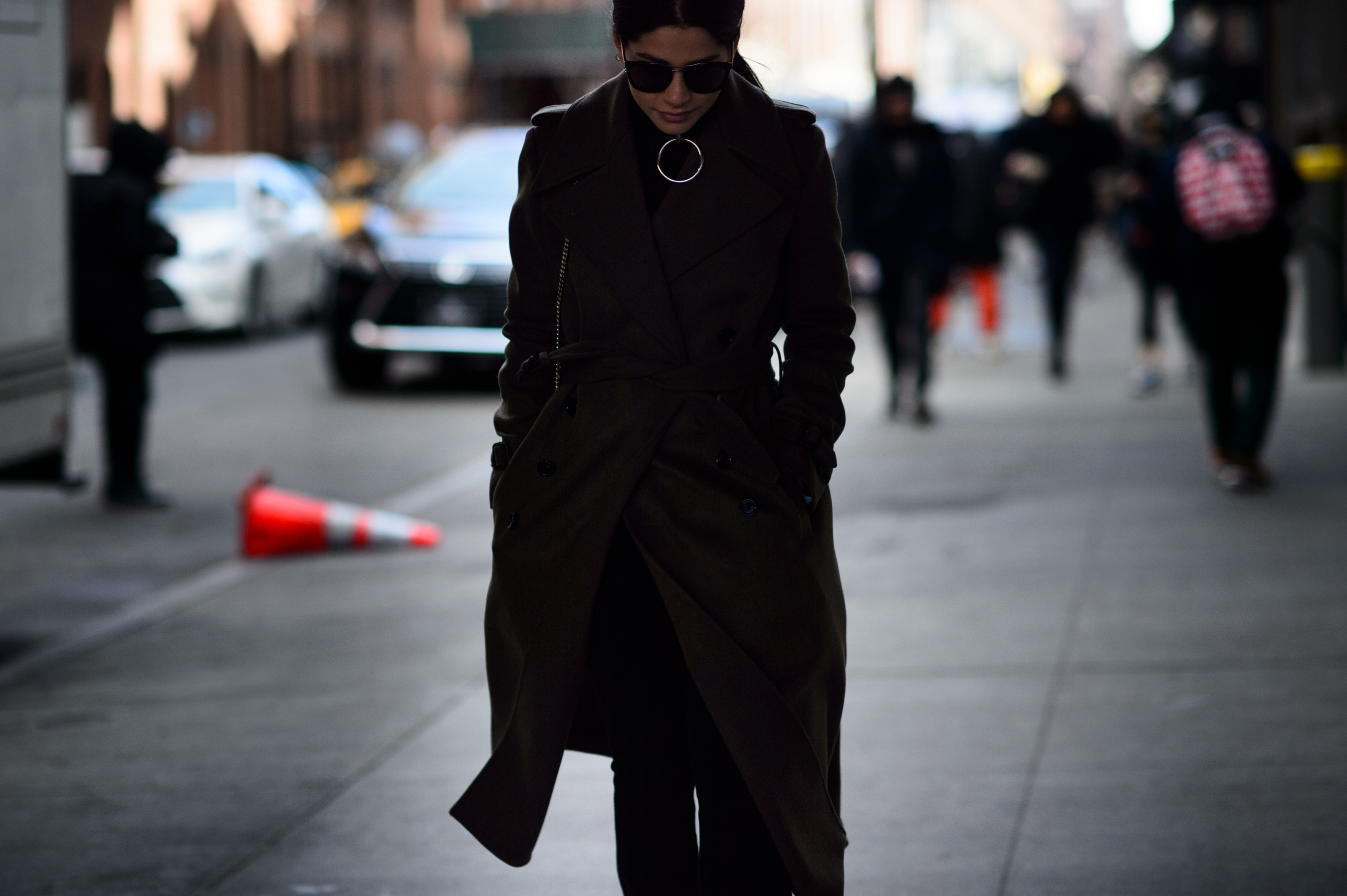 Woman wearing choker and coat