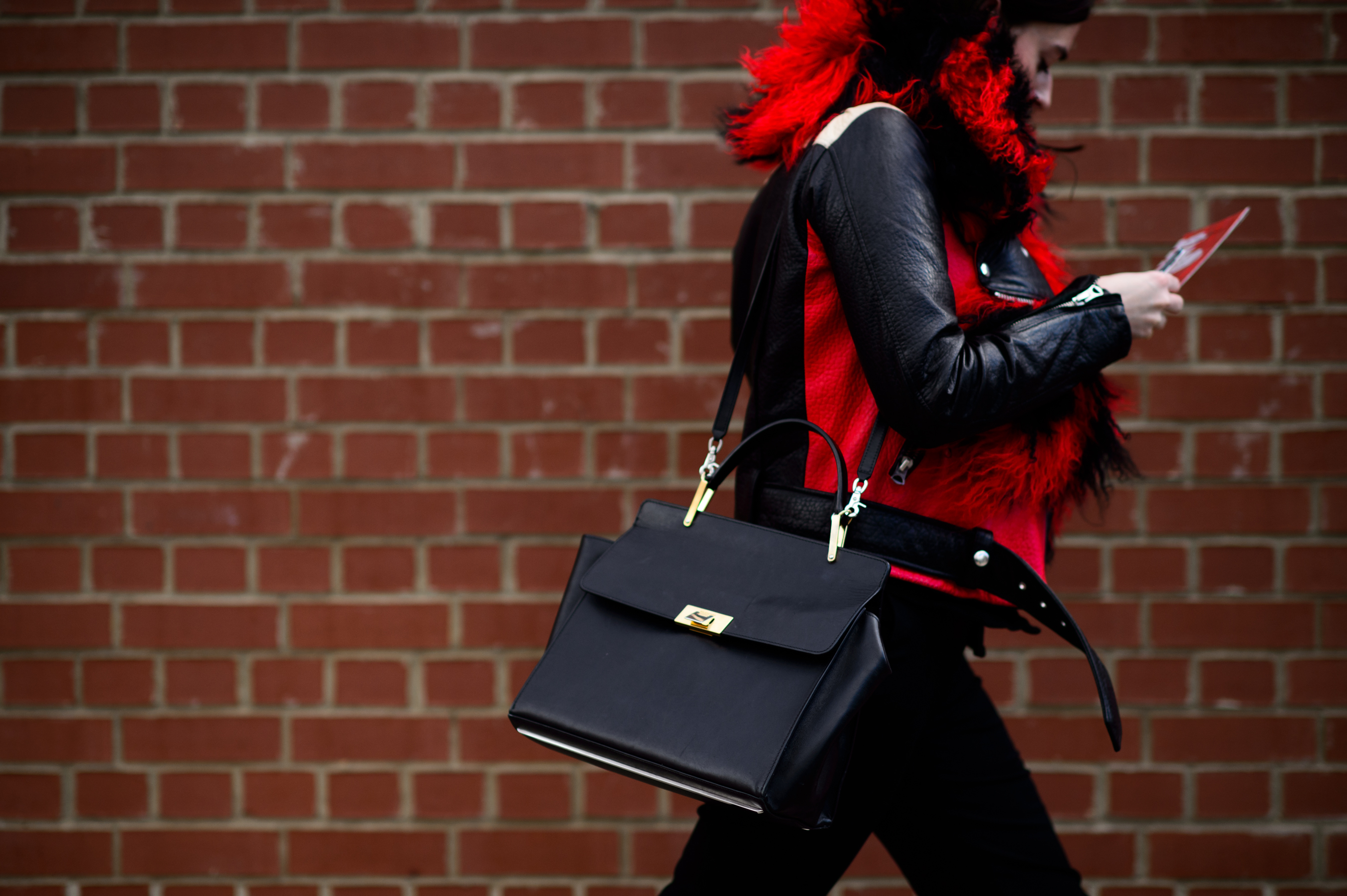 Woman wearing red fur and leather
