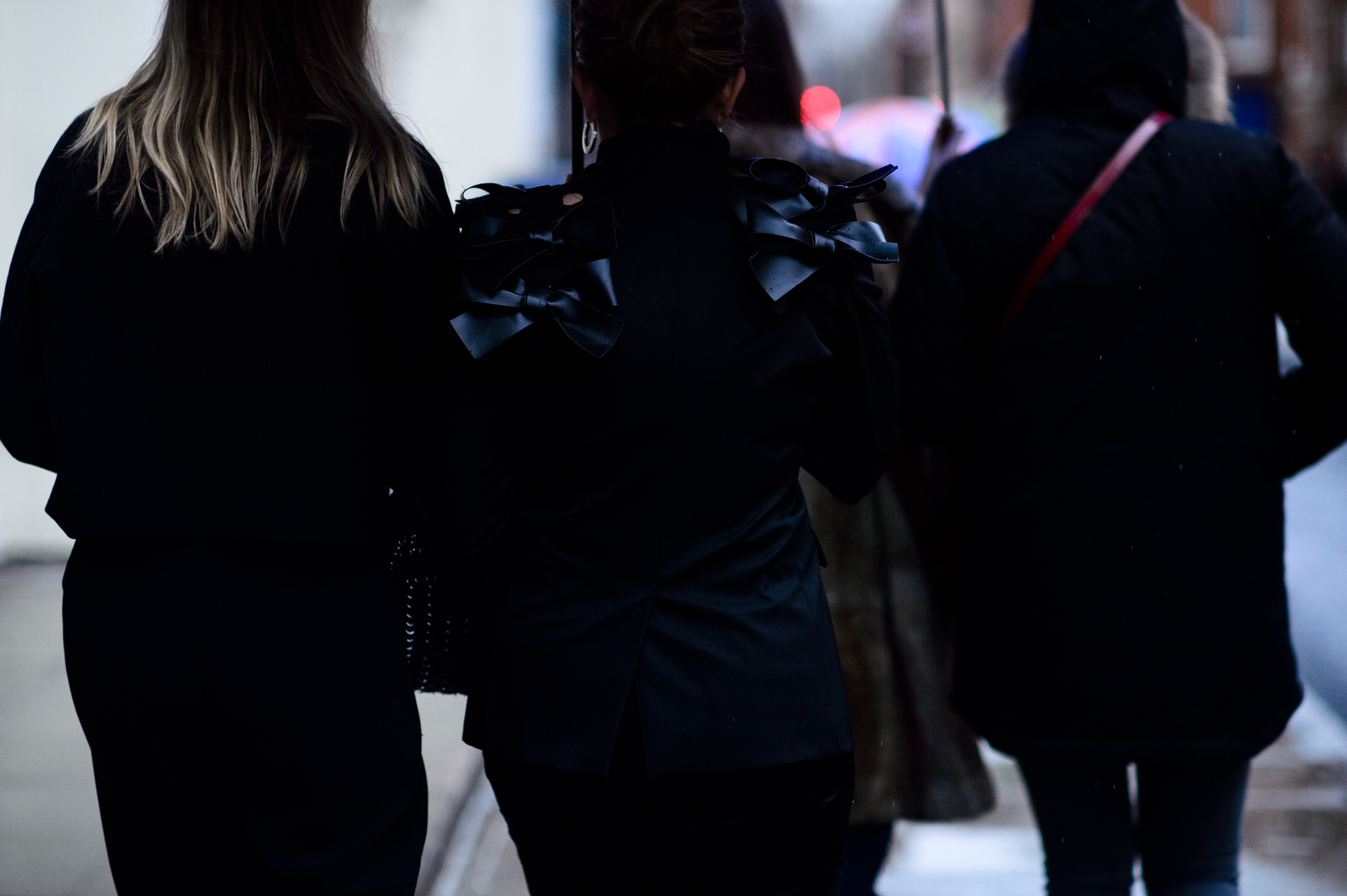 Woman wearing jacket with ribbons