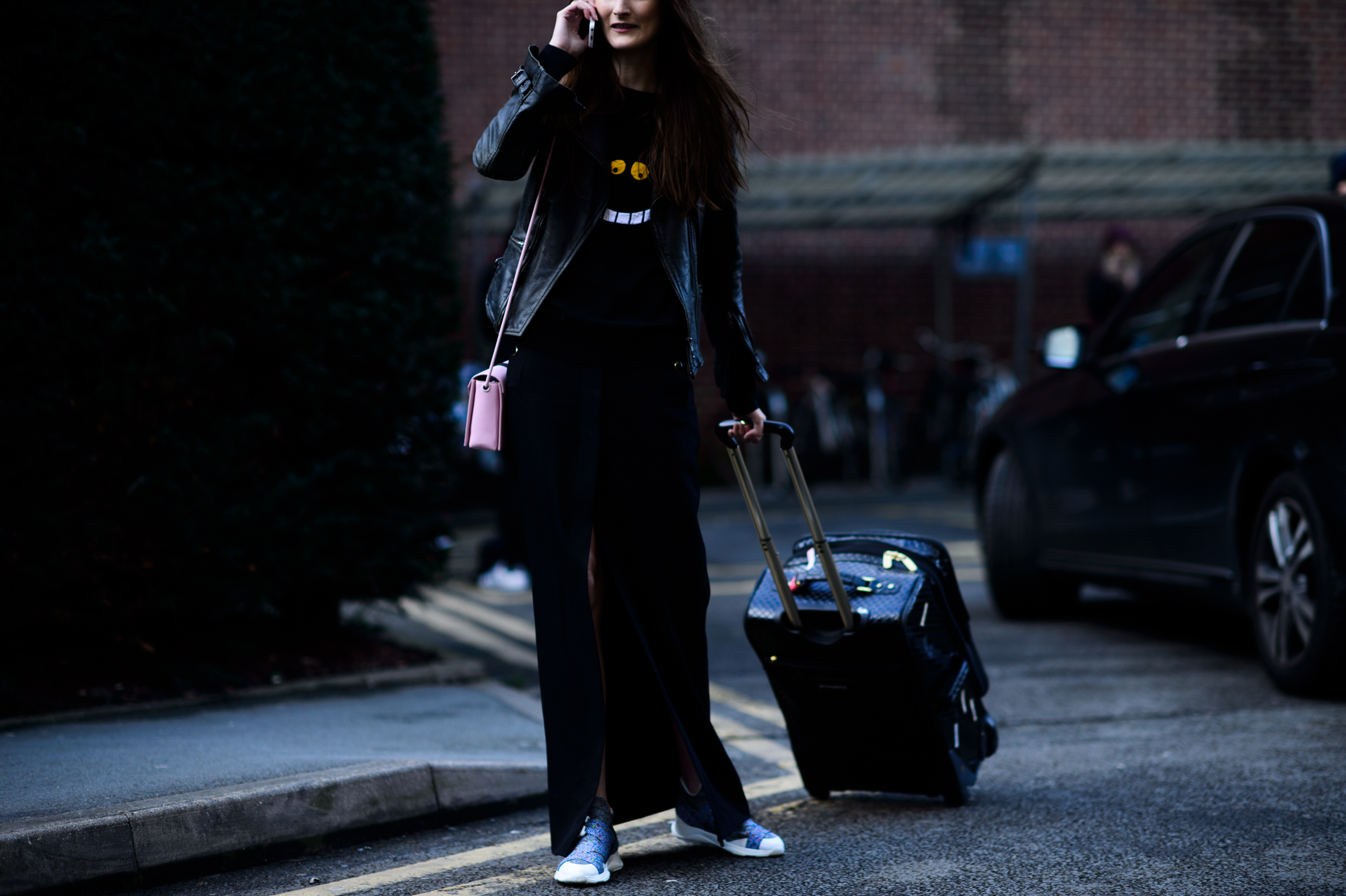 Model with suitcase after the show