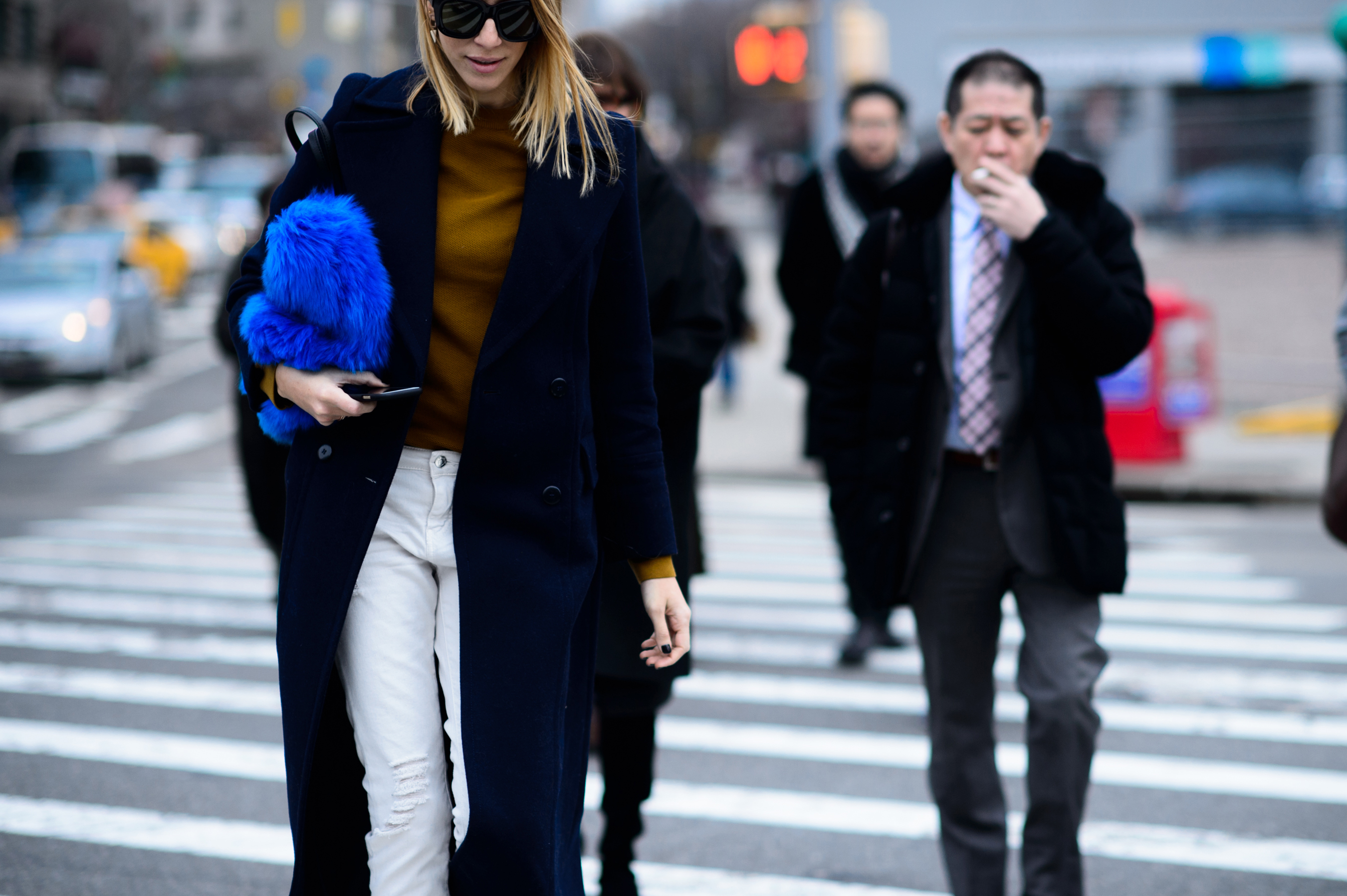 Woman with blue furry clutch