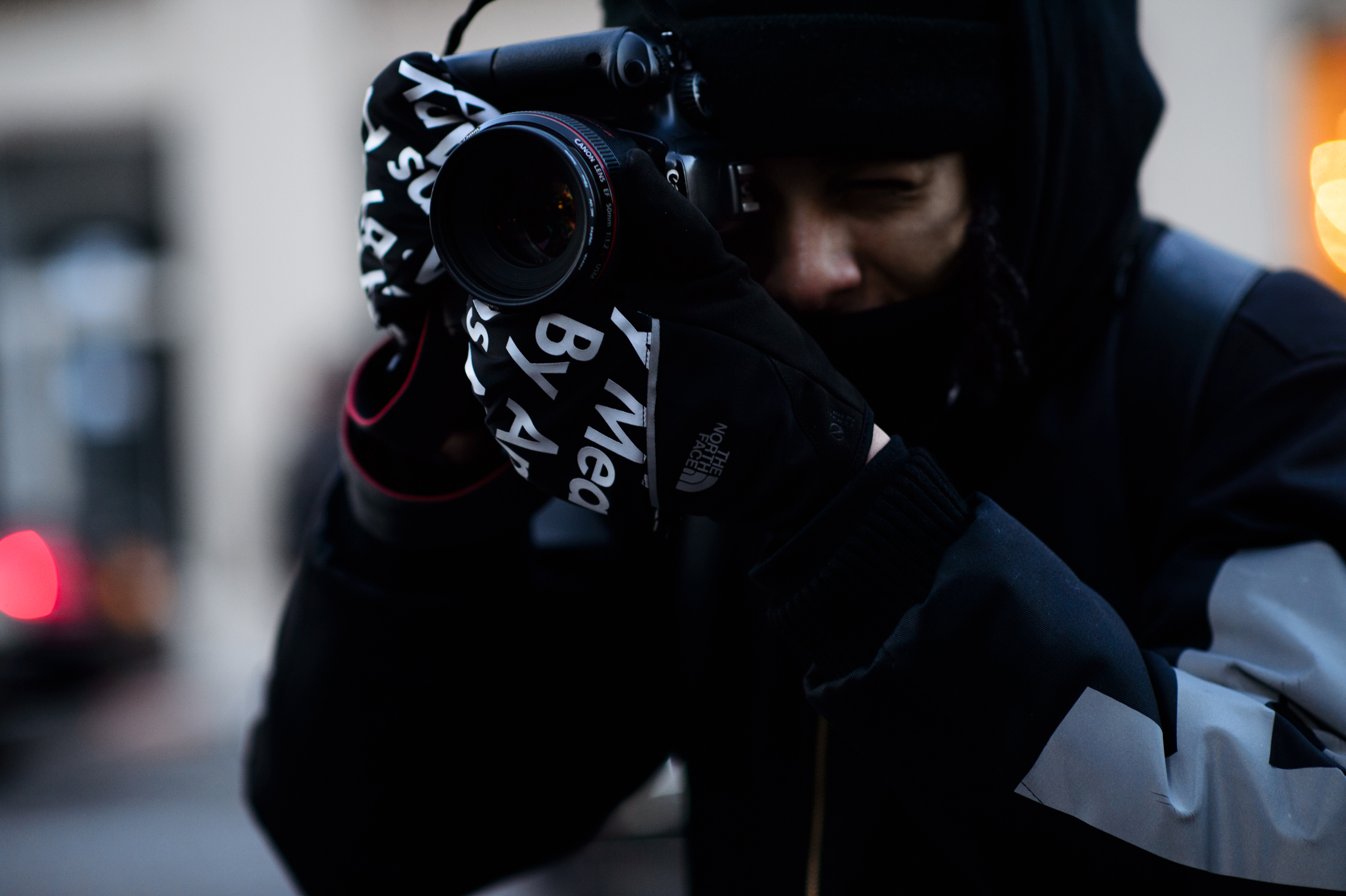 Close up of photographer Supreme gloves