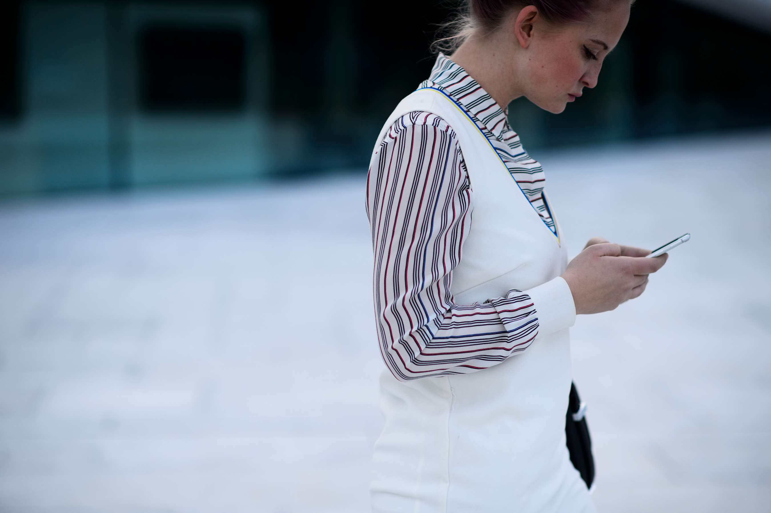 Women in white dress is texting