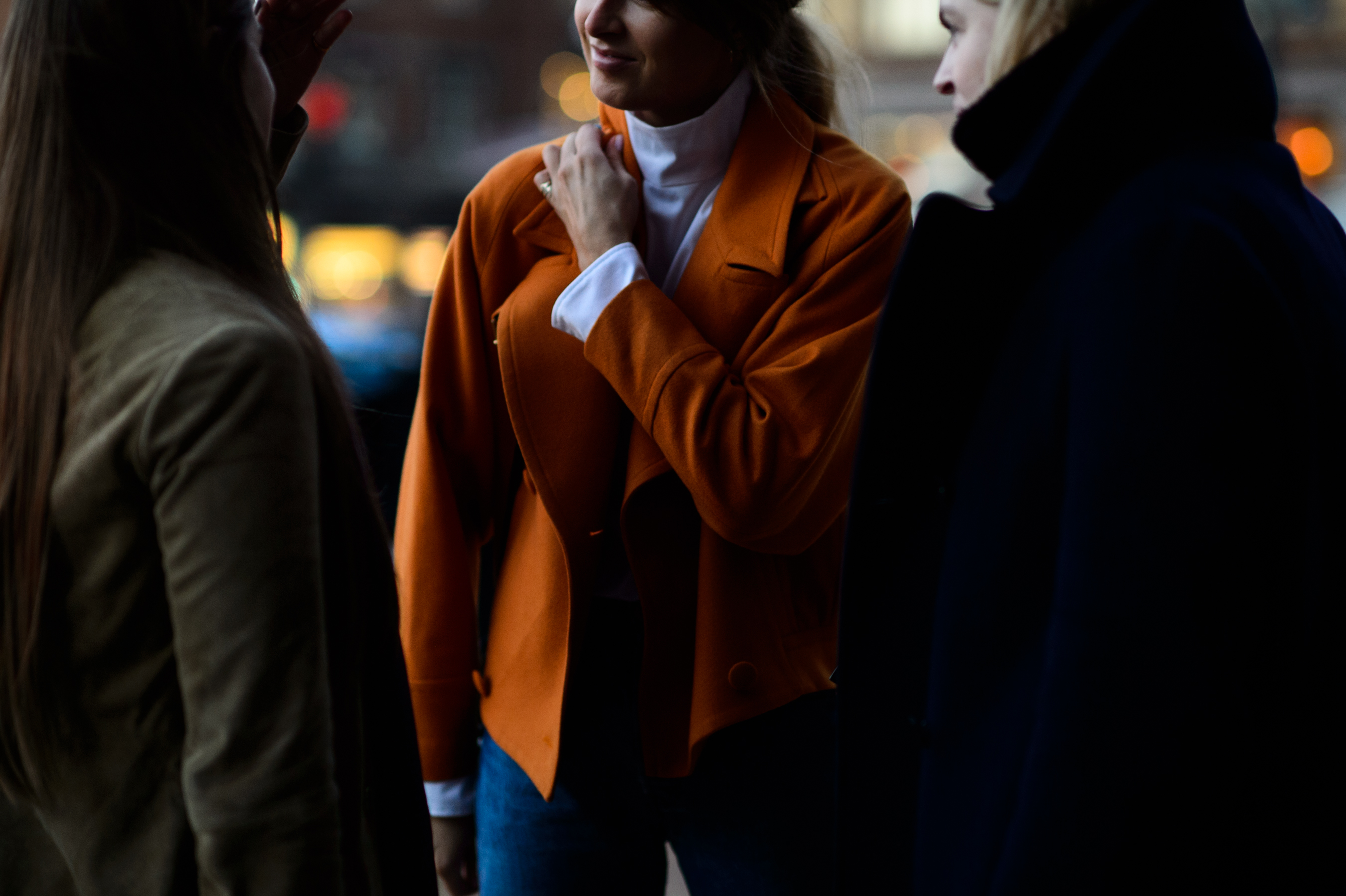 Woman in orange jacket