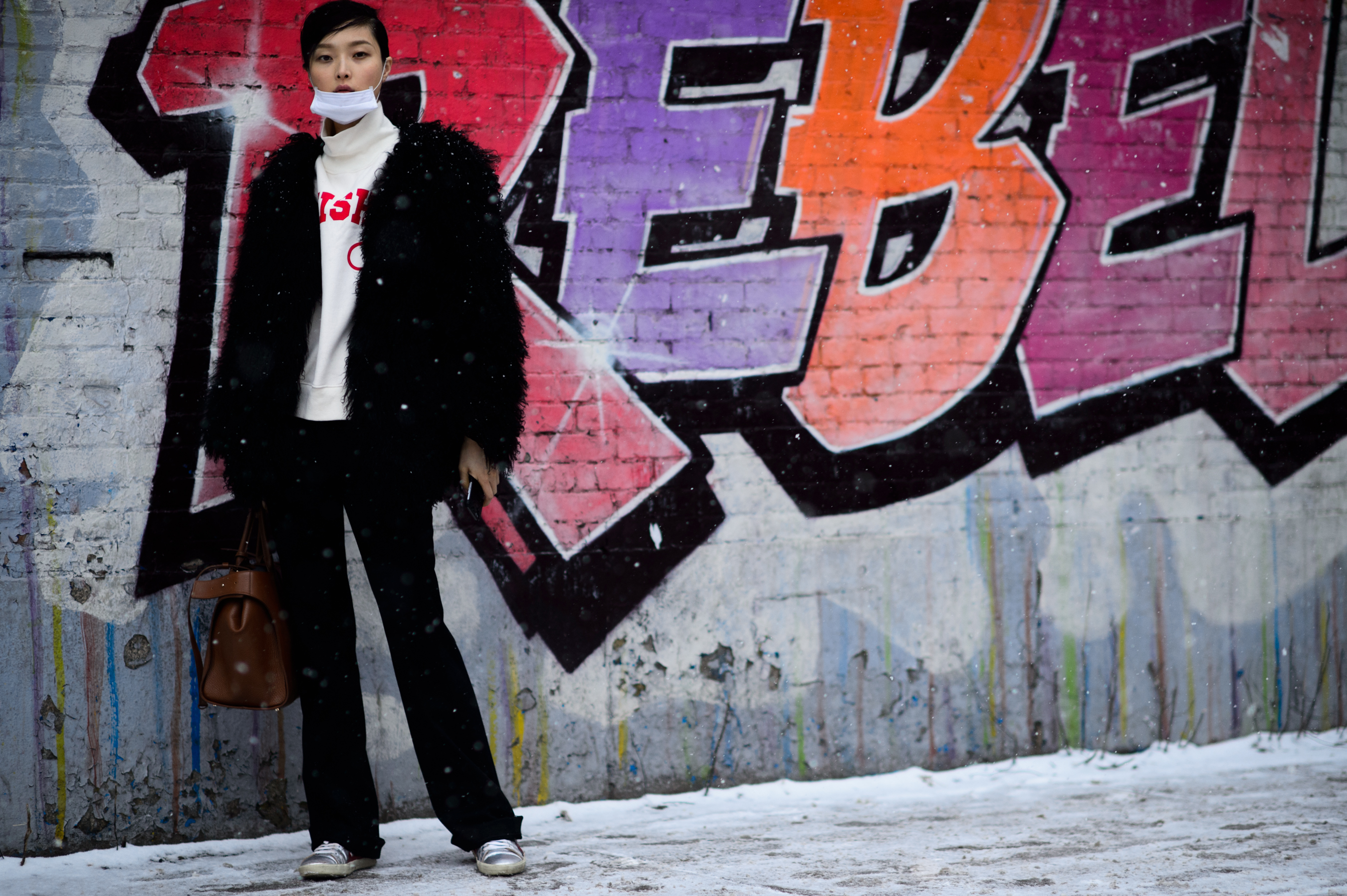 Korean model next to Rebel wall