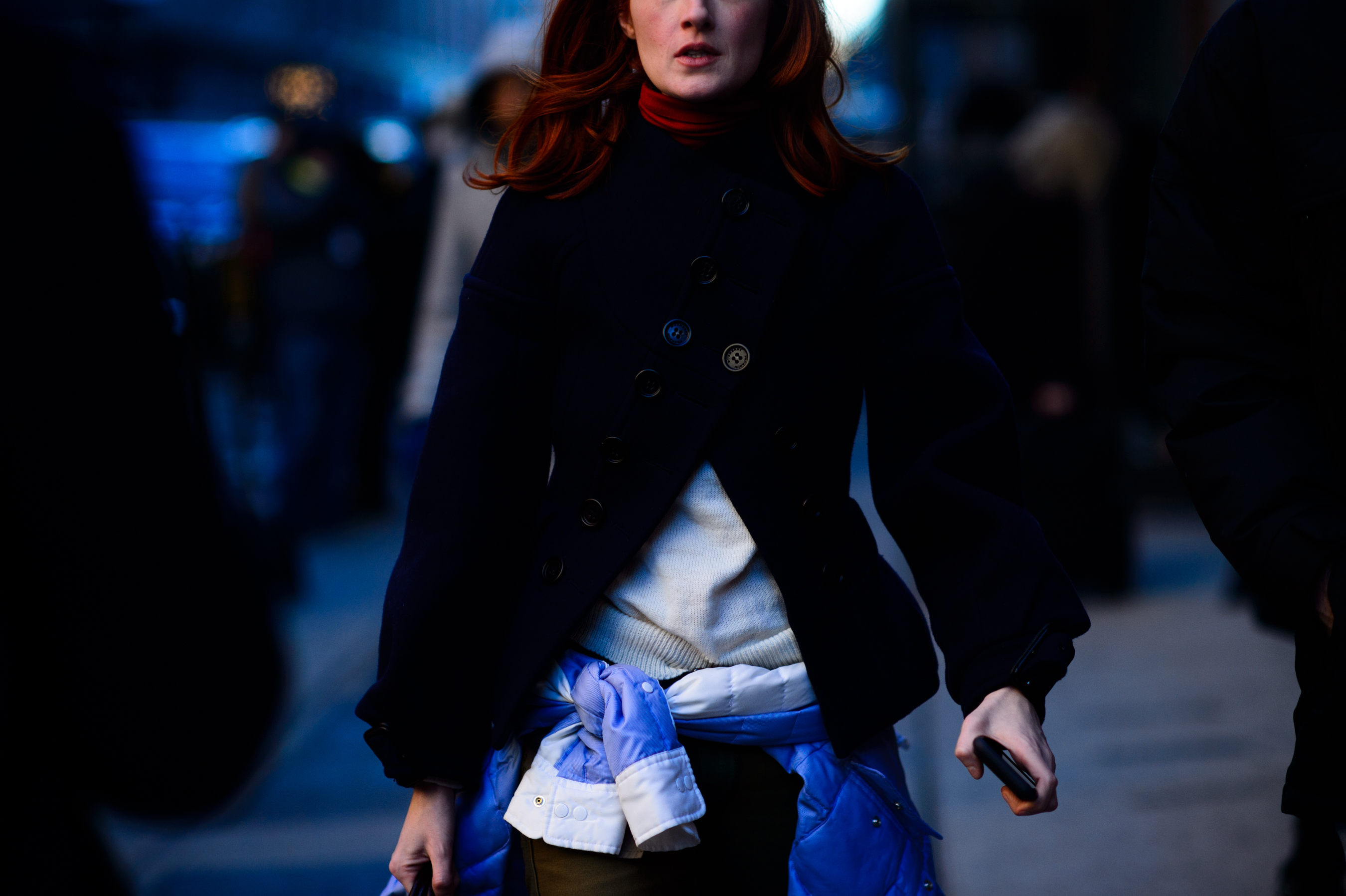 Woman wrapped jacket around hips