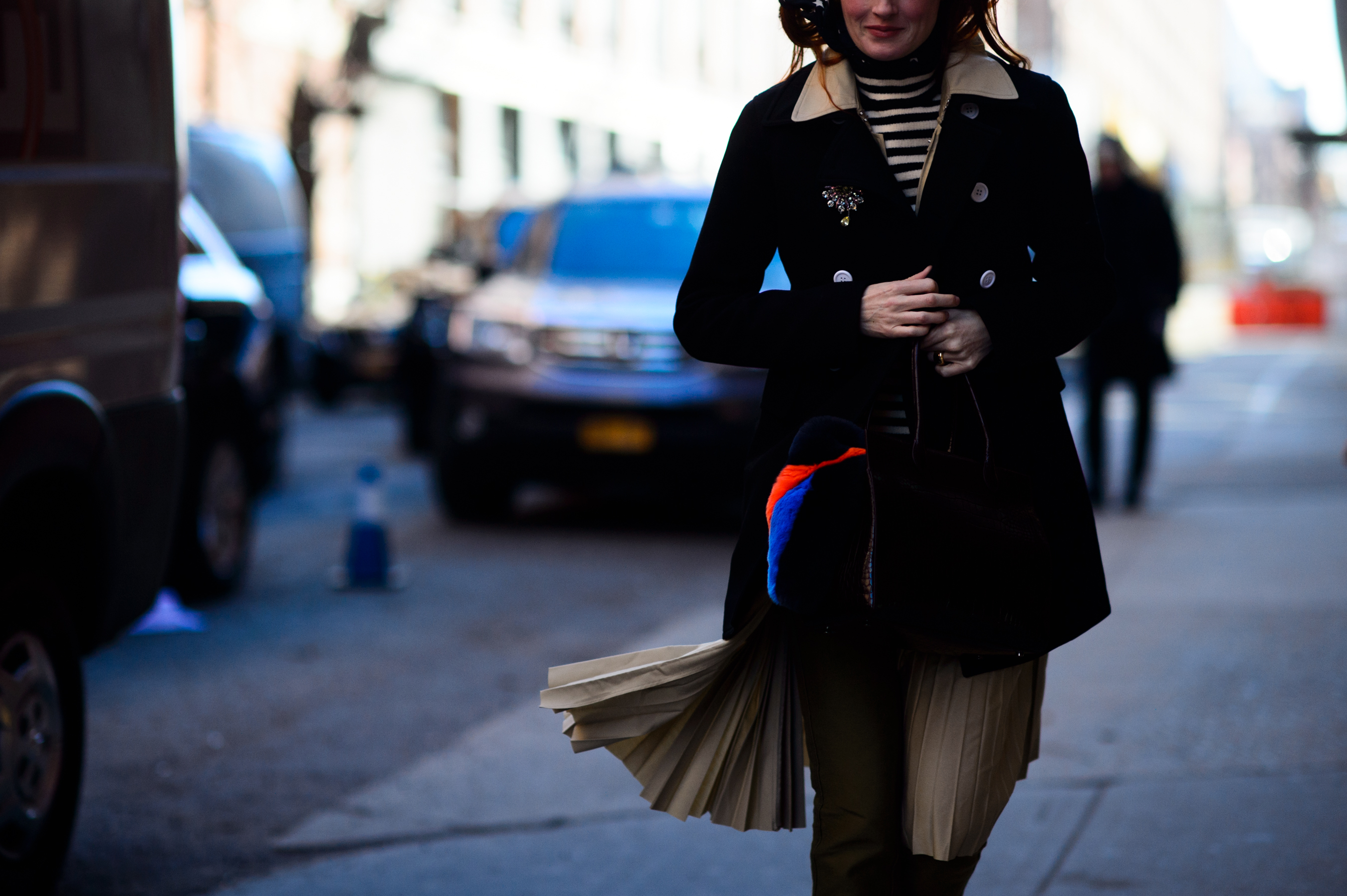 Woman wearing coat and skirt