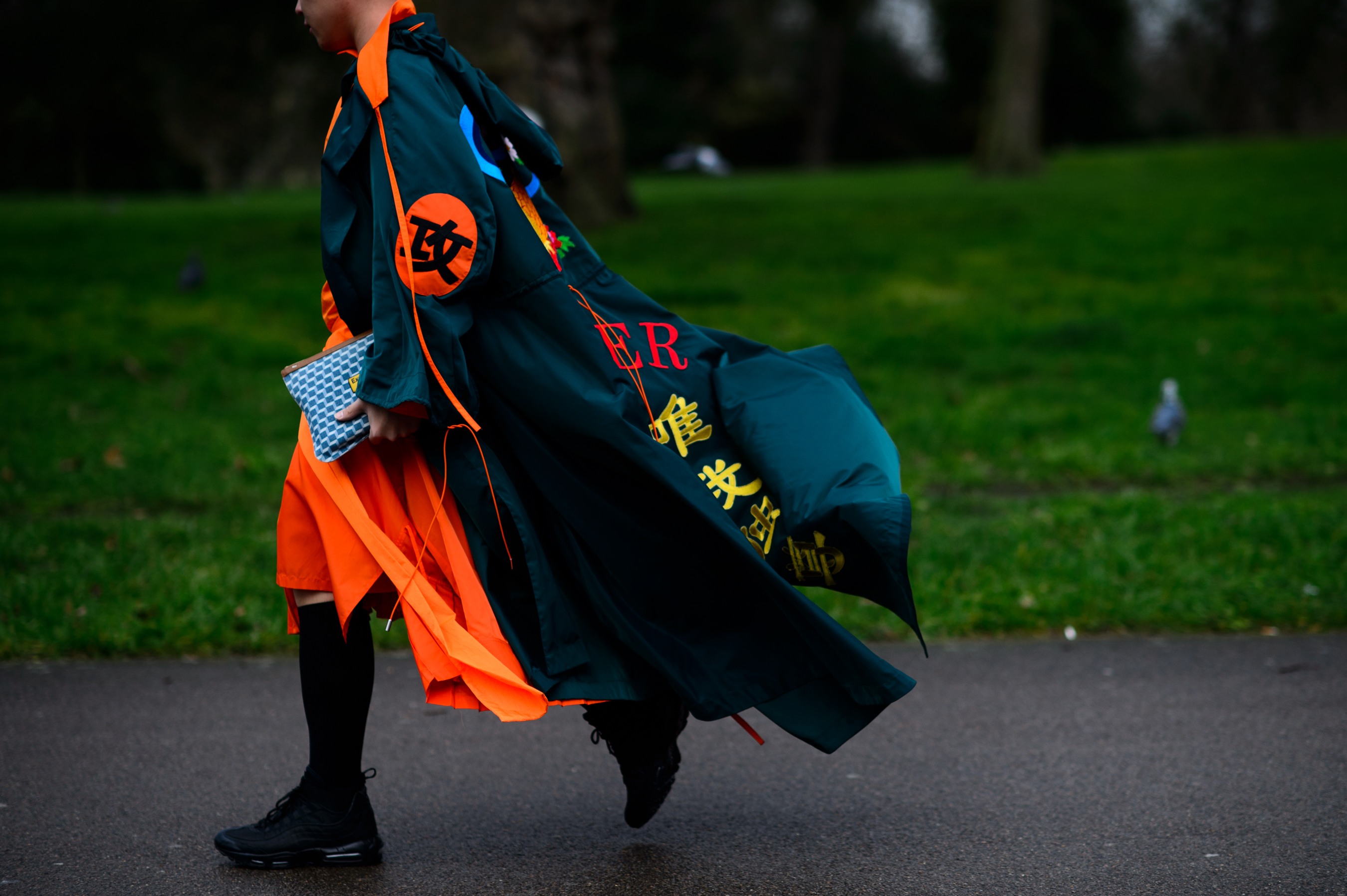 Chinese man wearing long epic cape