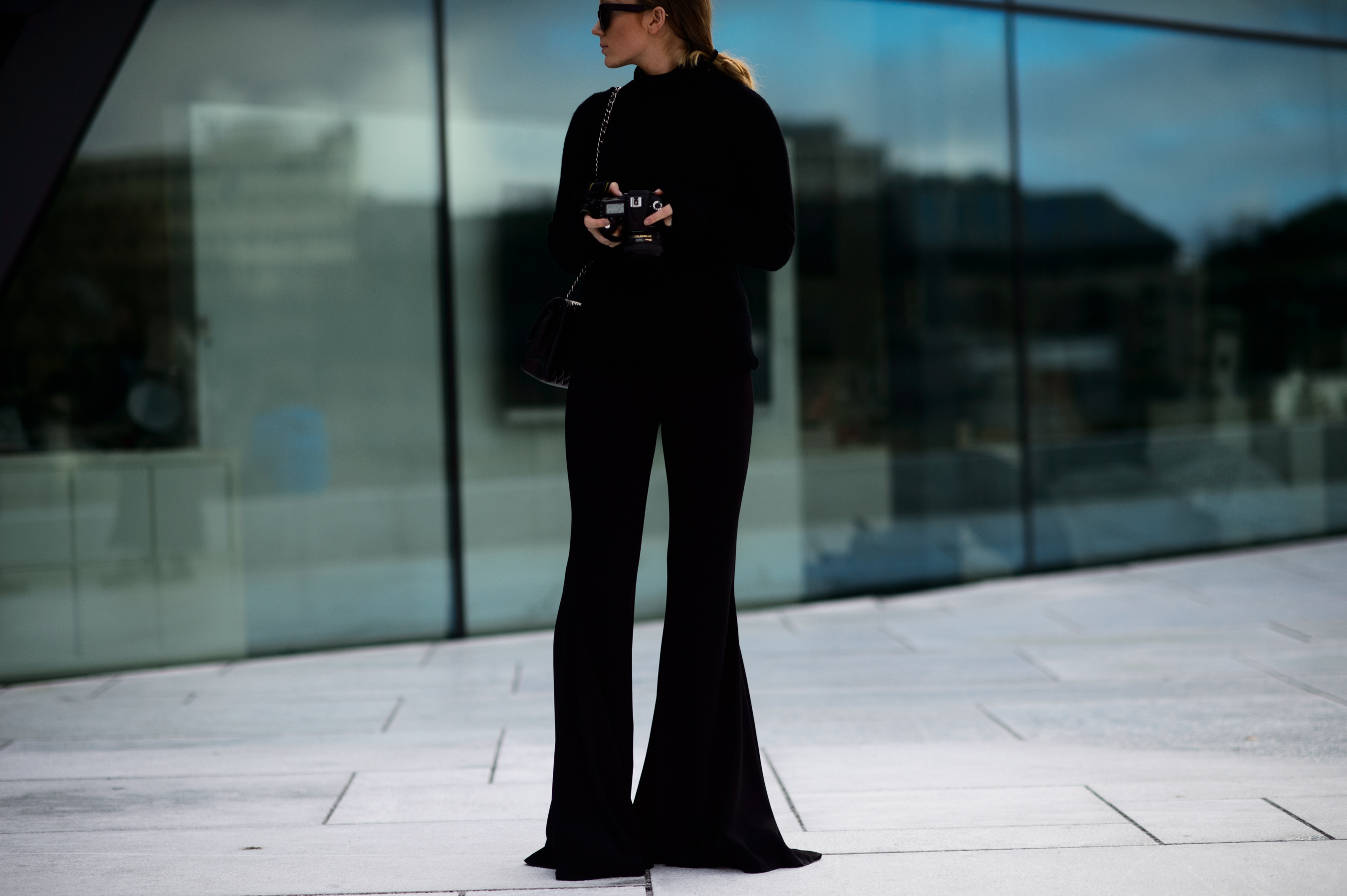 Woman wearing black bootcut pants