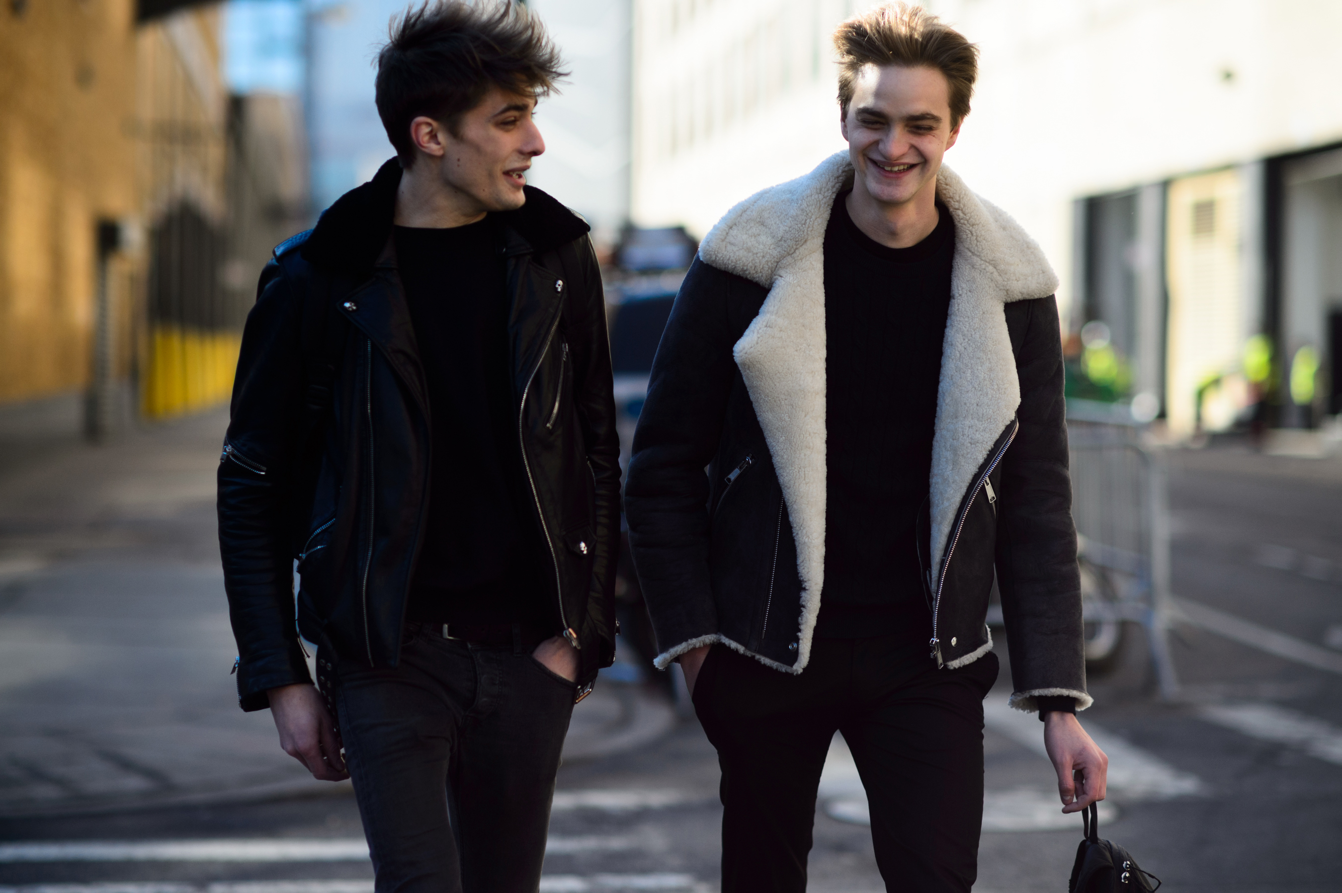 Two male models laughing