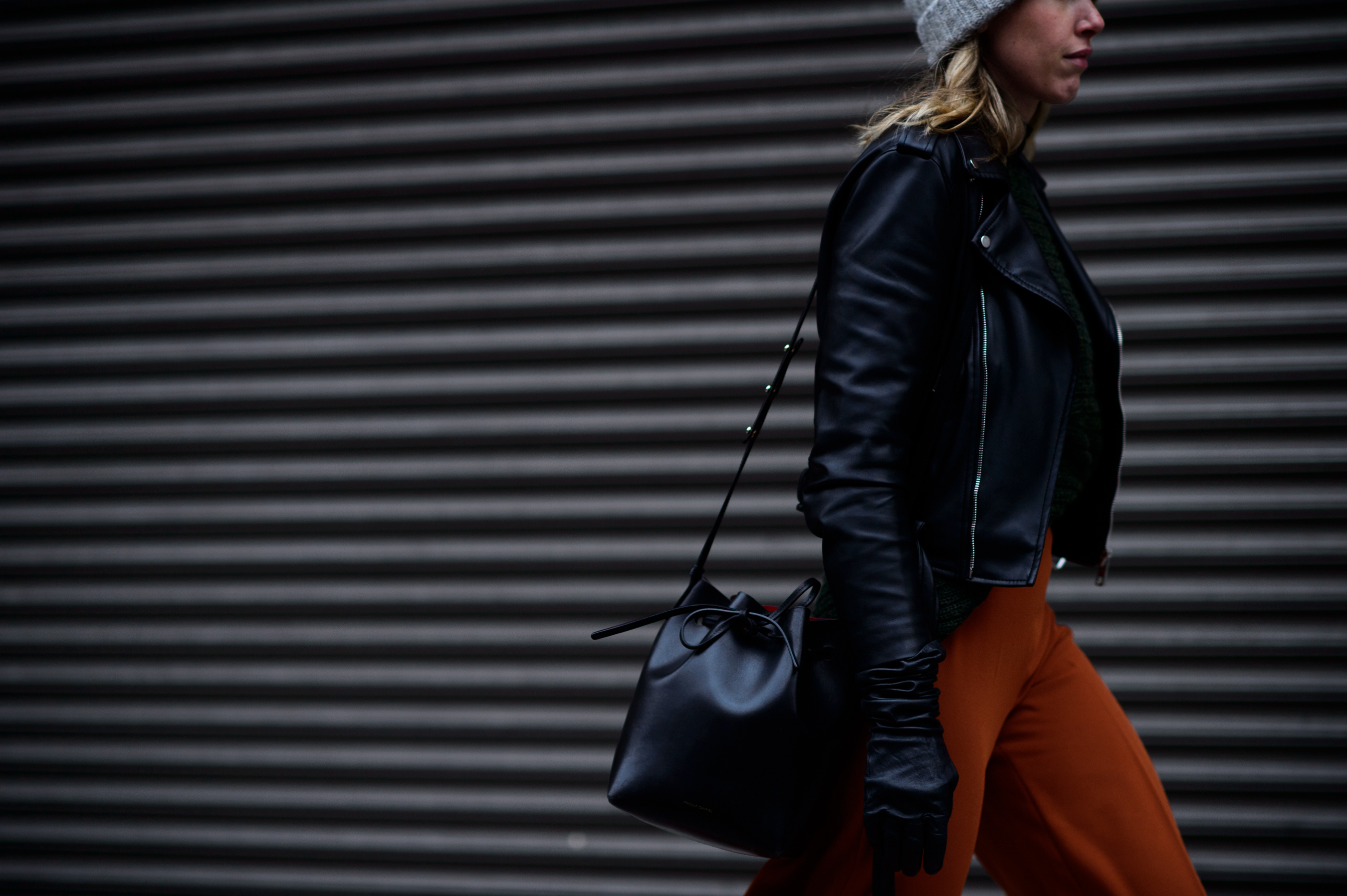 Woman with black bag leather gloves