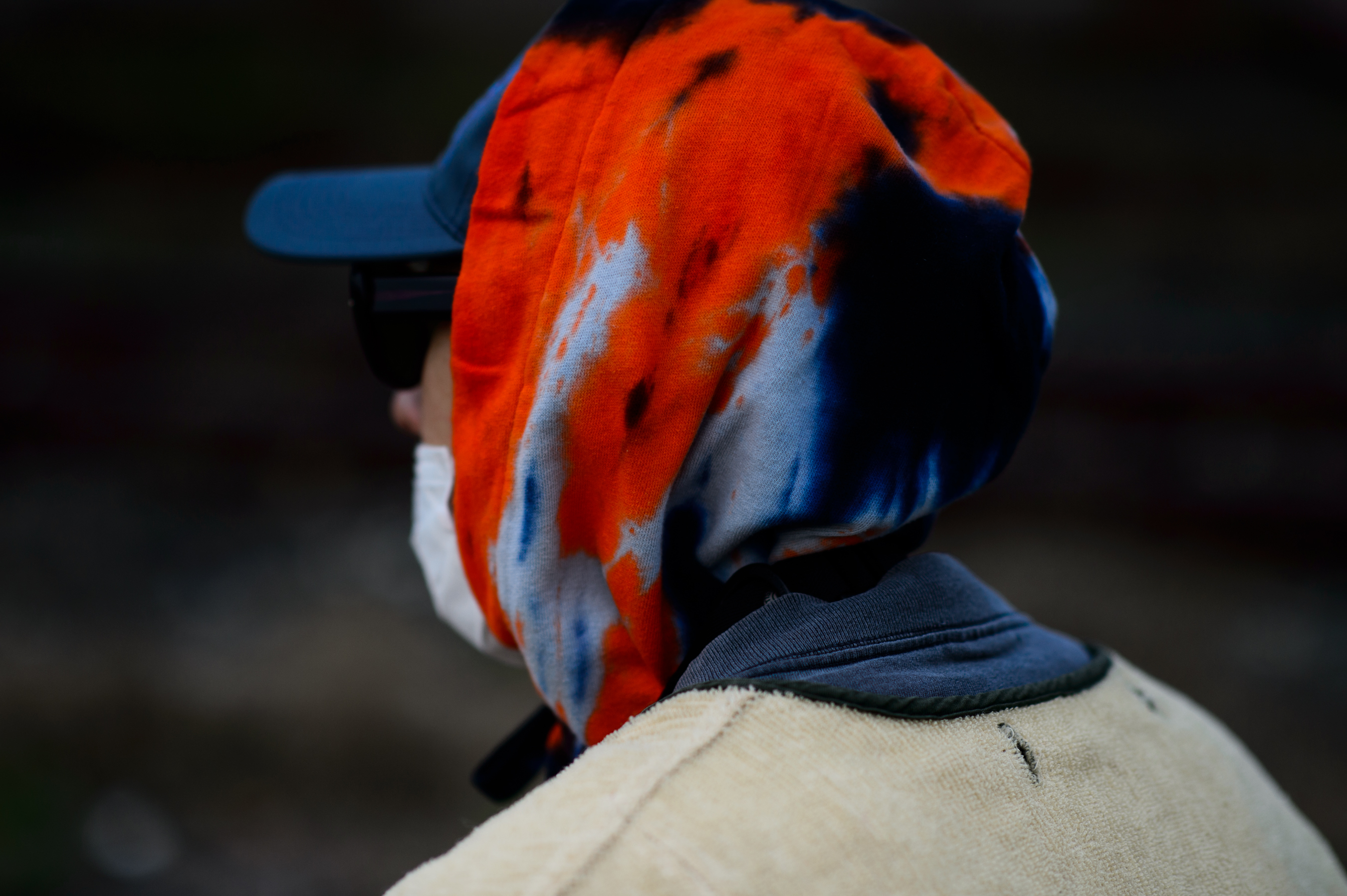Korean photographer wearing hood