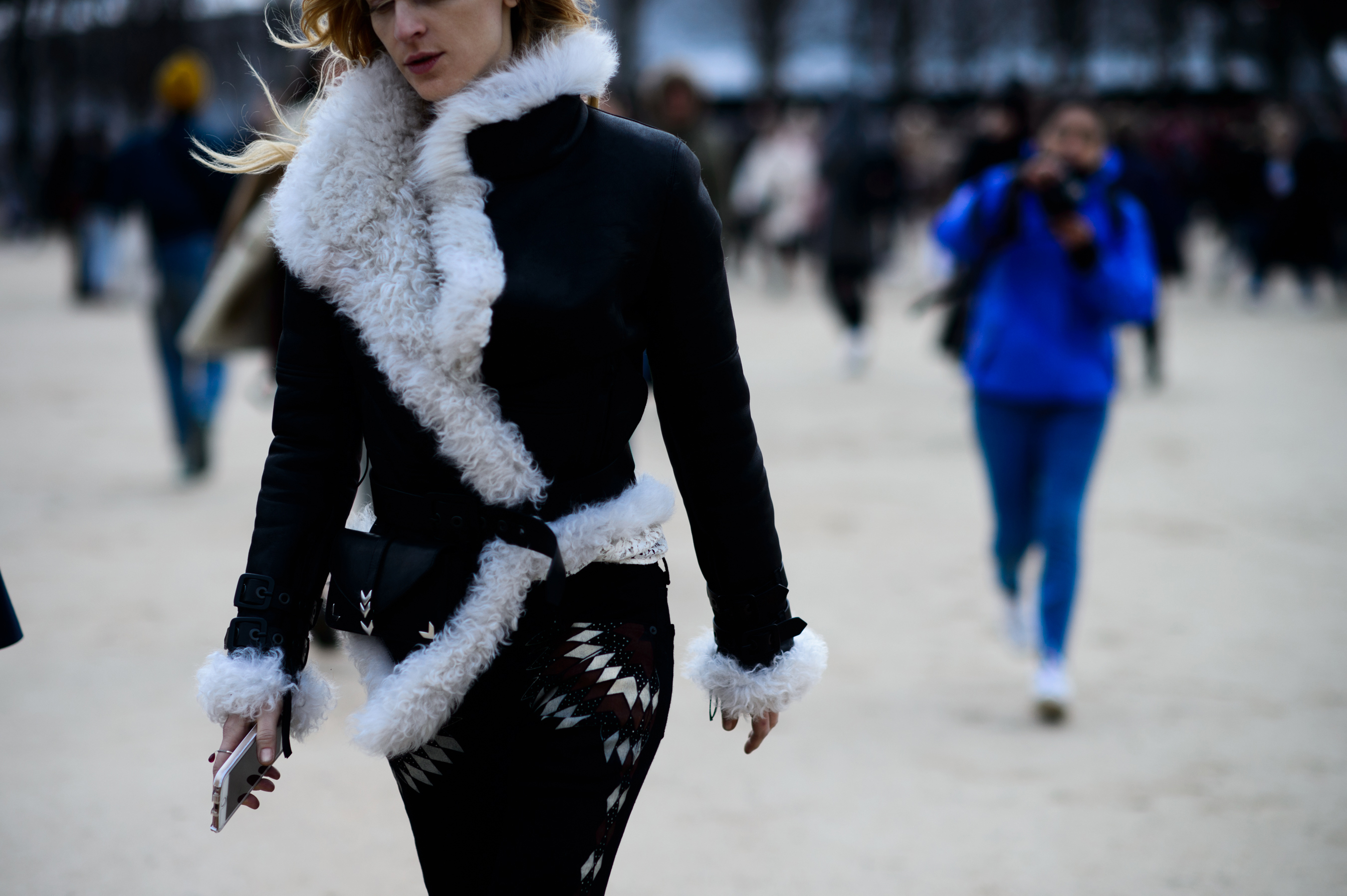 Woman wearing shearling and suede jacket