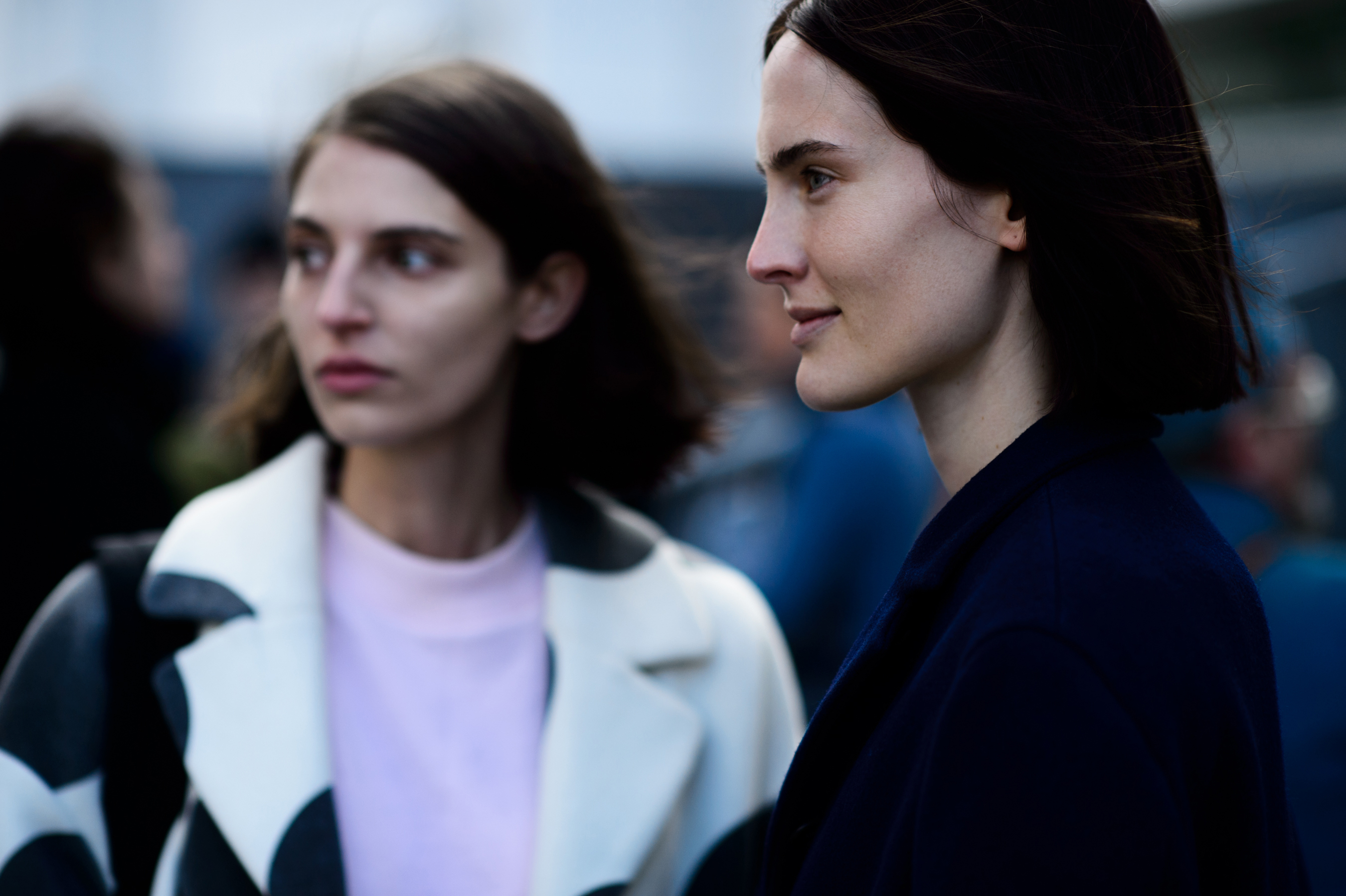 Closeup of two women looking into the distance