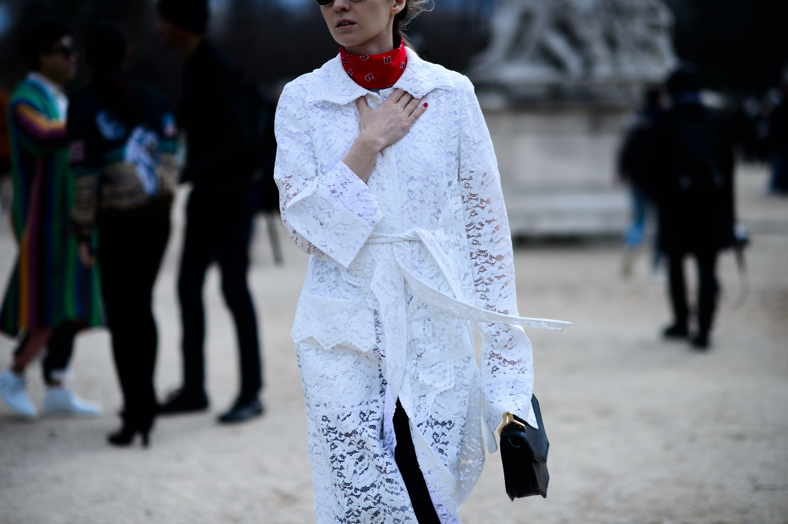 Woman wearing white lace overcoat