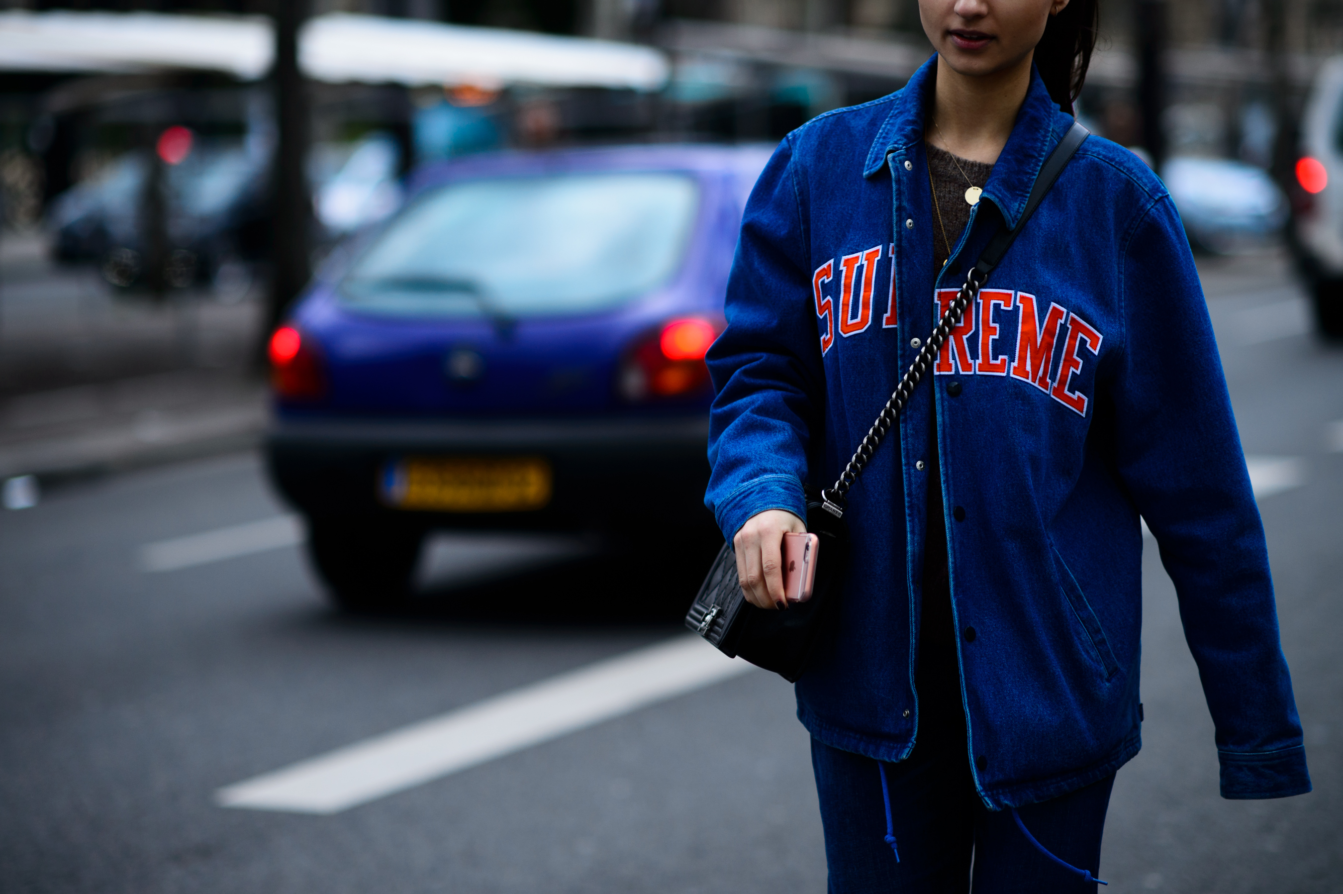 Woman wearing Supreme denim jacket