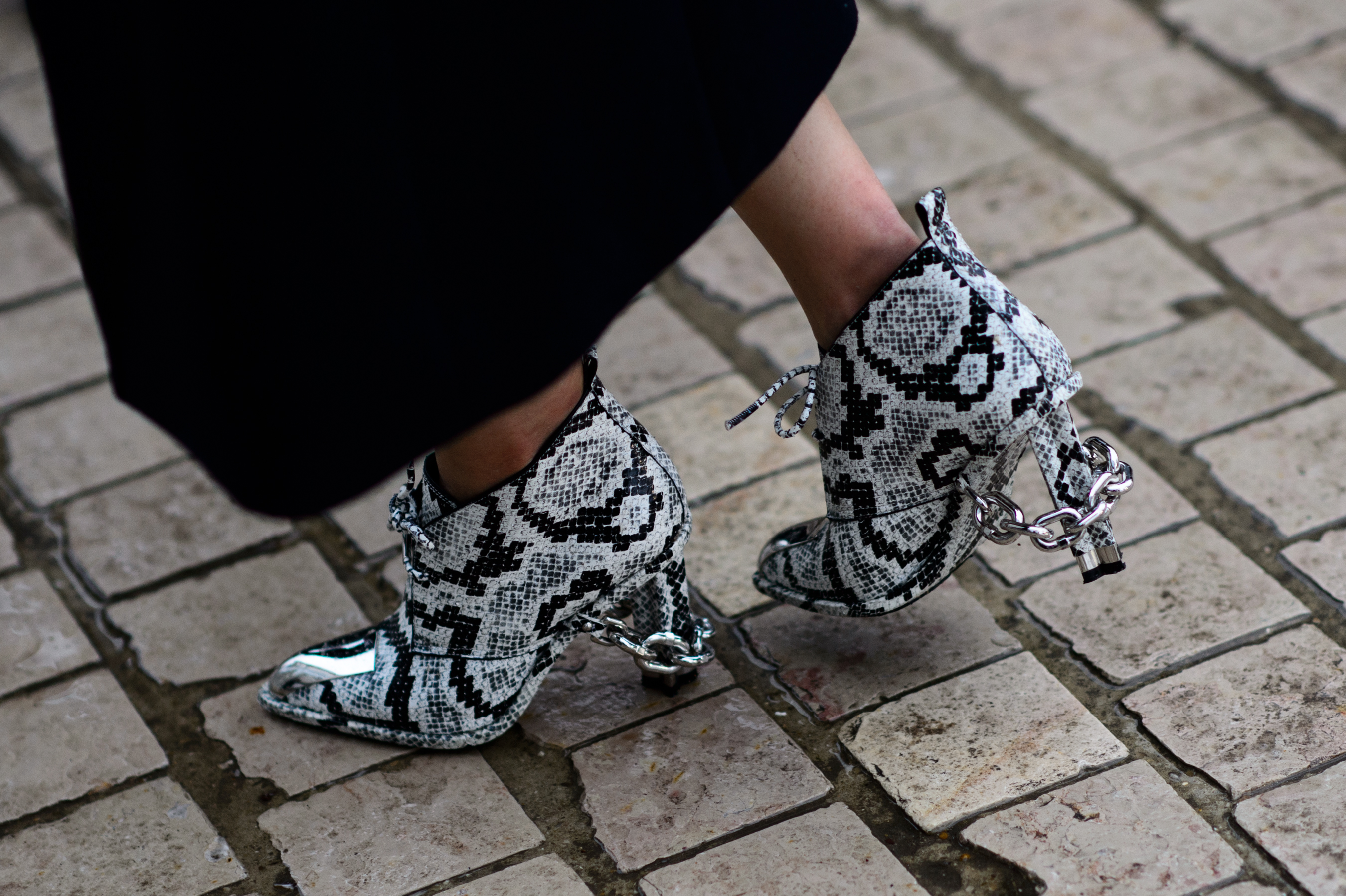 Closeup of woman wearing snakeskin heels