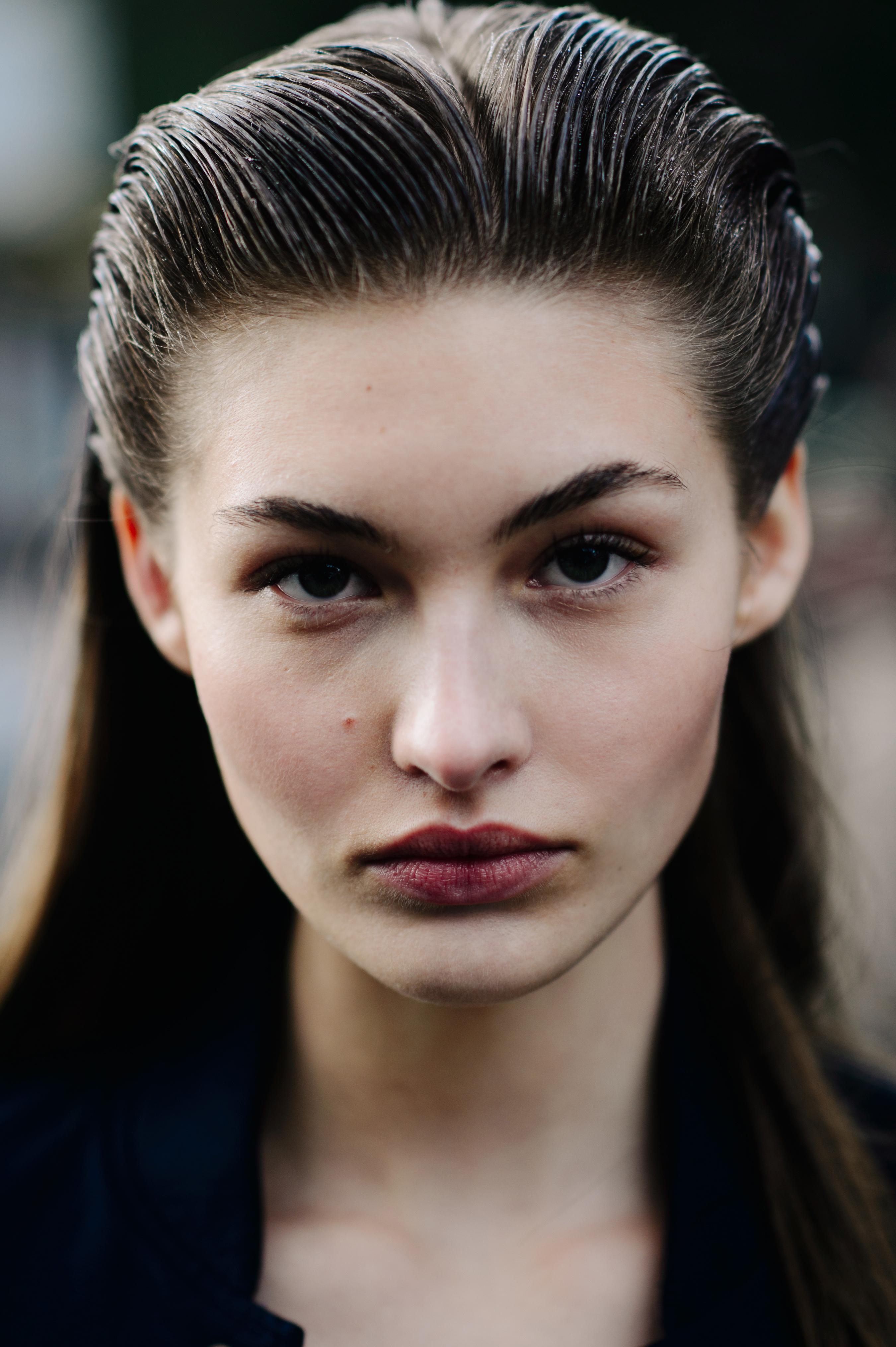 Portrait of model with brown slick combed hair