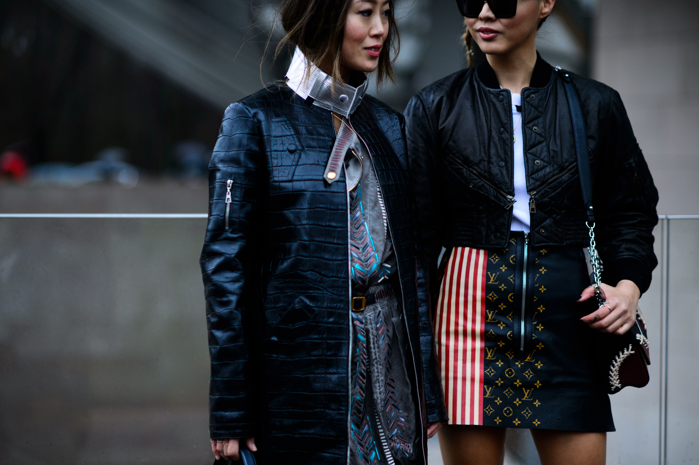 Two sisters wearing black and pattern outfits