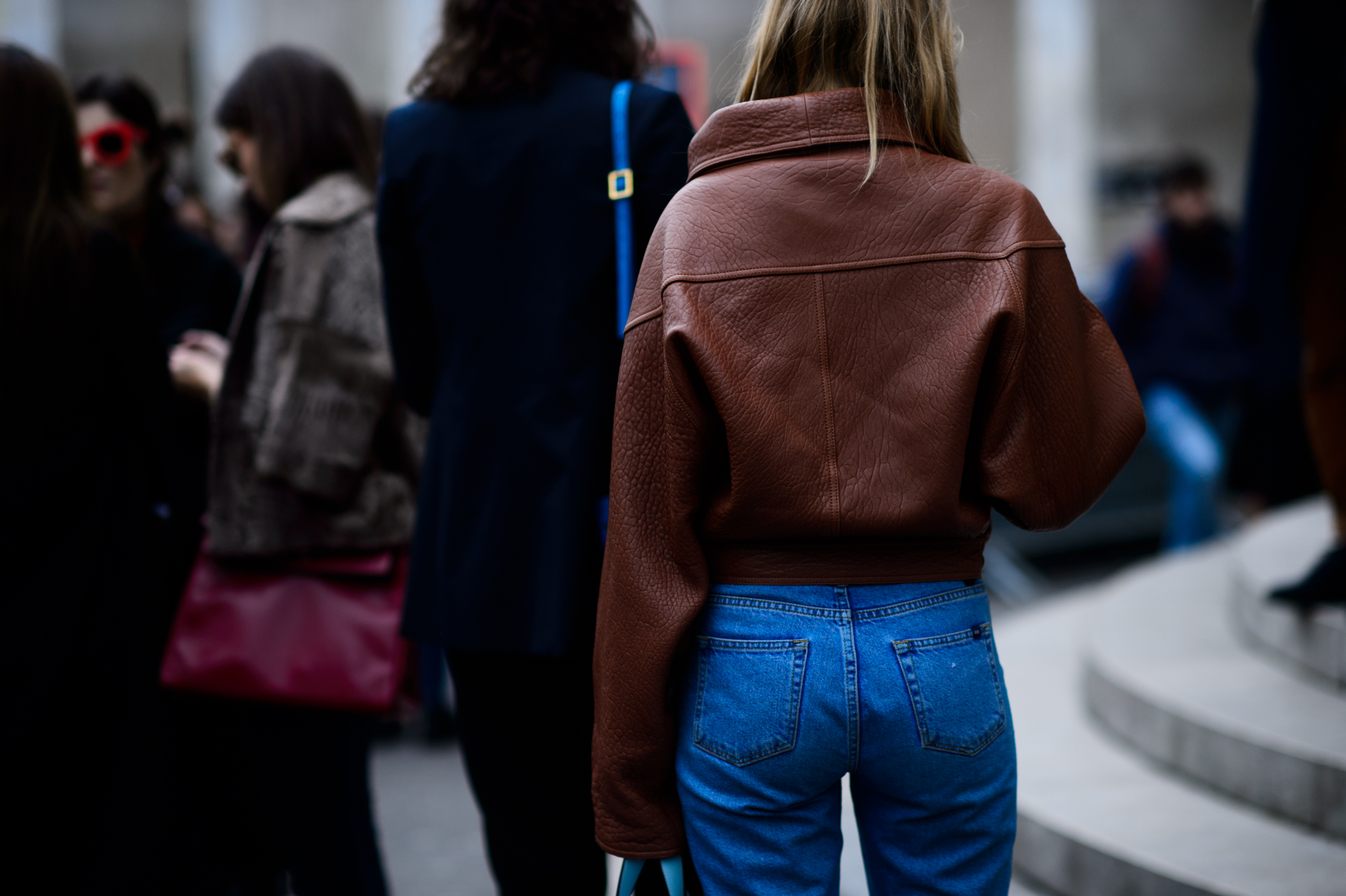 Woman wearing leather oversized bomber