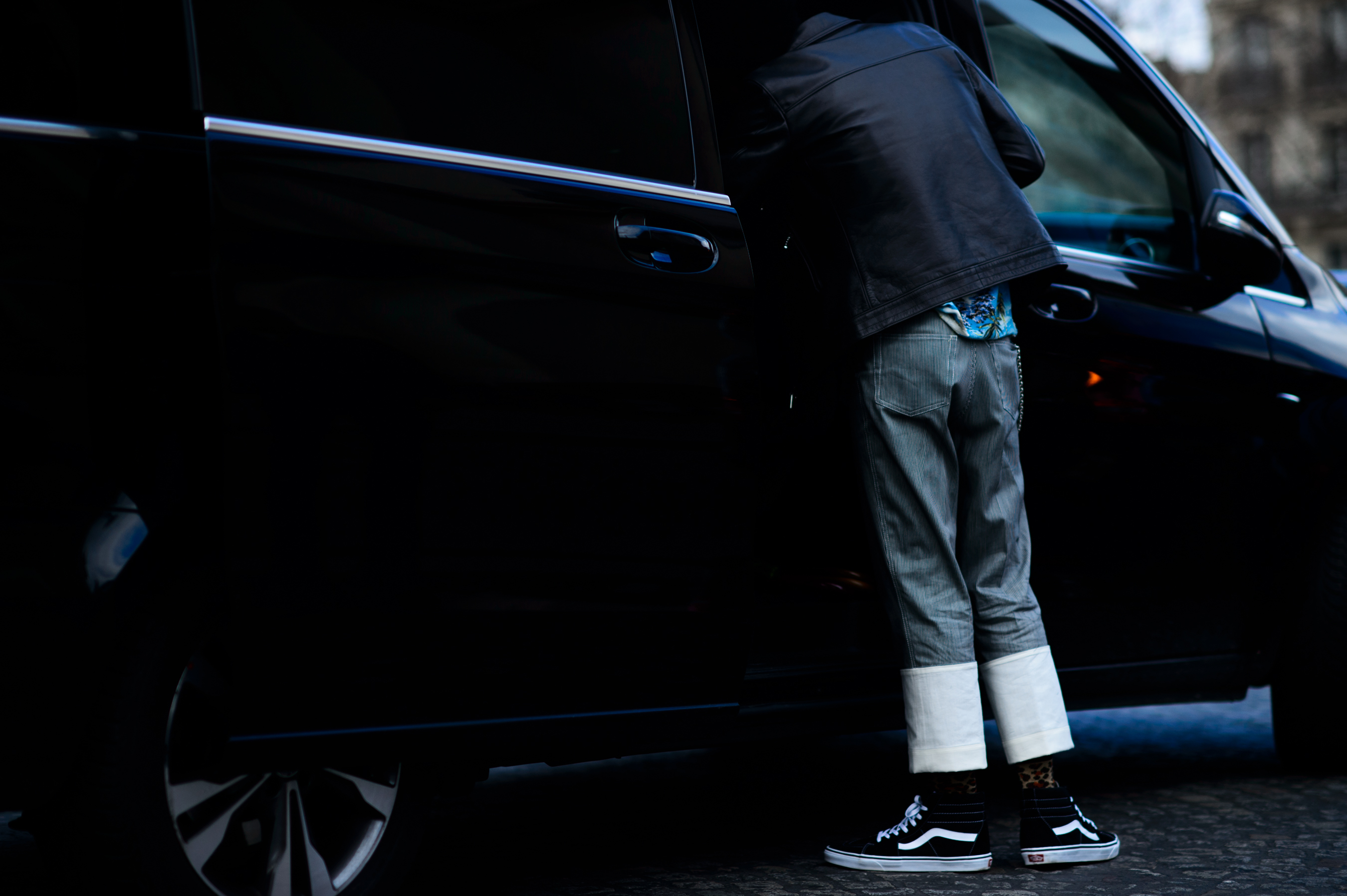 Buyer wearing turned up denim and skate shoes